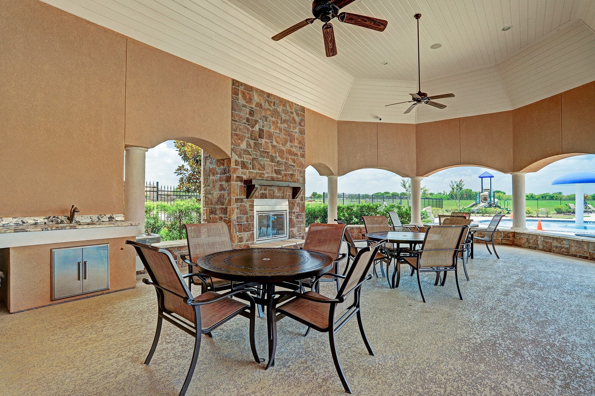 A covered outdoor pavilion with a fireplace is great for evening events.