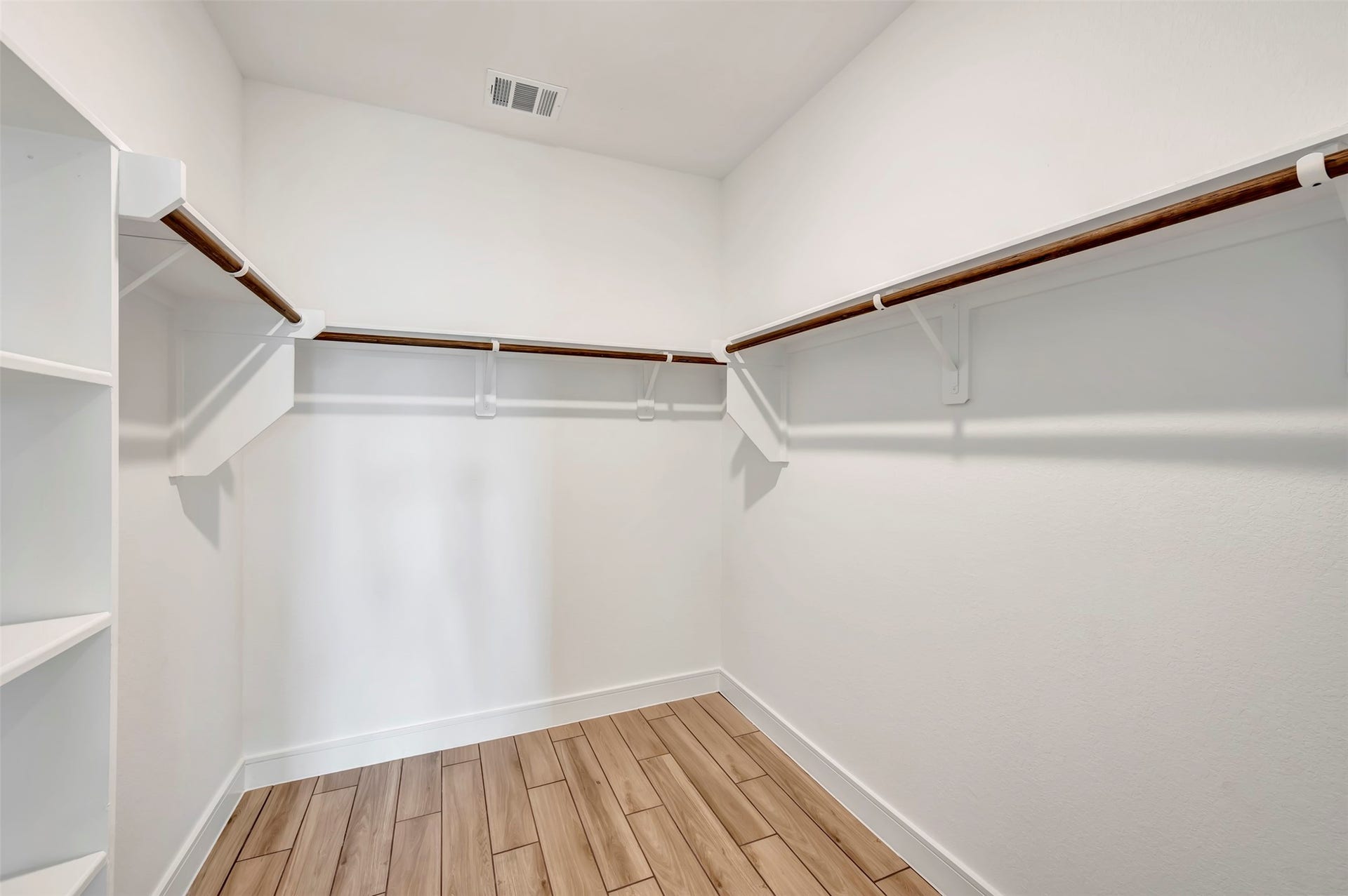 Primary walk-in closet (*Photo not of actual home and used for illustration purposes only.)