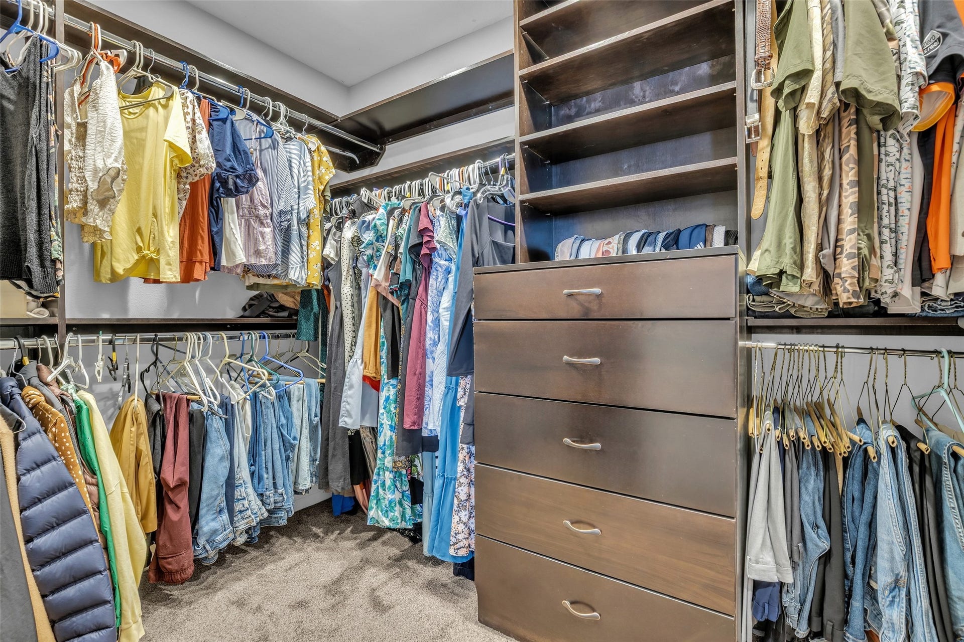 5511 Hialeah Drive, Houston, TX 77092 Large walk in closet with built-ins and shelving to the ceiling is sure to please any clothing lover!