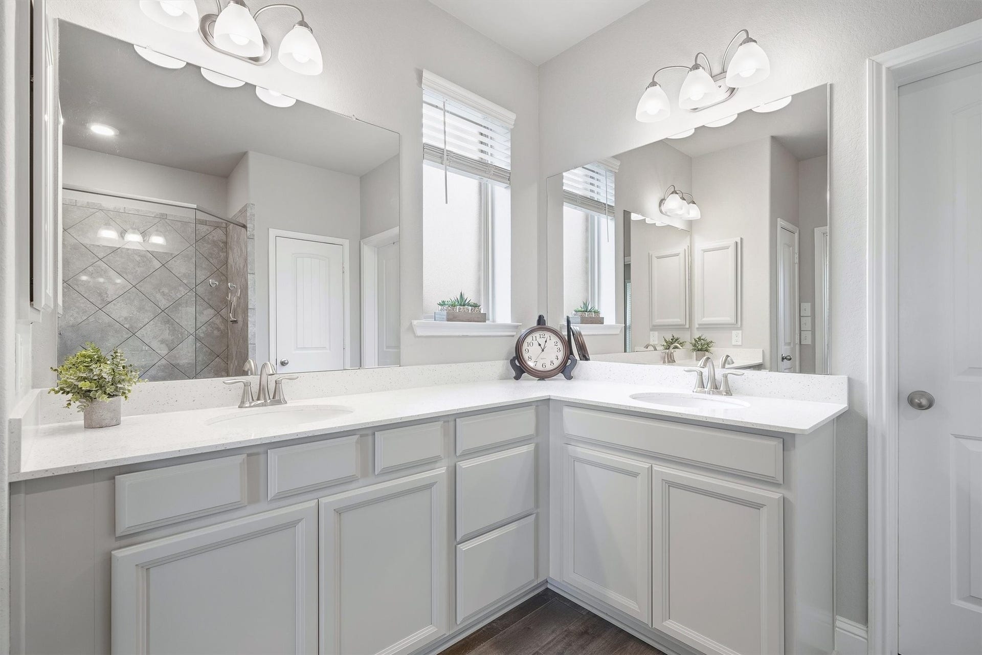 9034 Japonica Drive, Rosenberg, TX 77469 Dual vanities + bright whites = modern bathroom perfection.