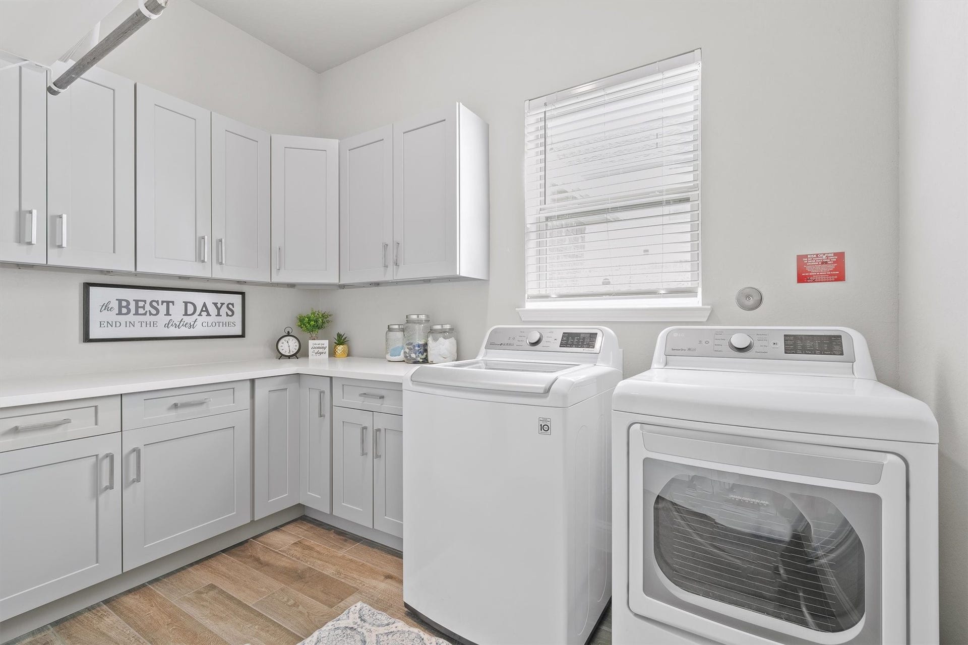 9034 Japonica Drive, Rosenberg, TX 77469 Laundry day just got a major upgrade. Custom wrap-around cabinetry, abundant counter space, and modern appliances make chore day effortless.