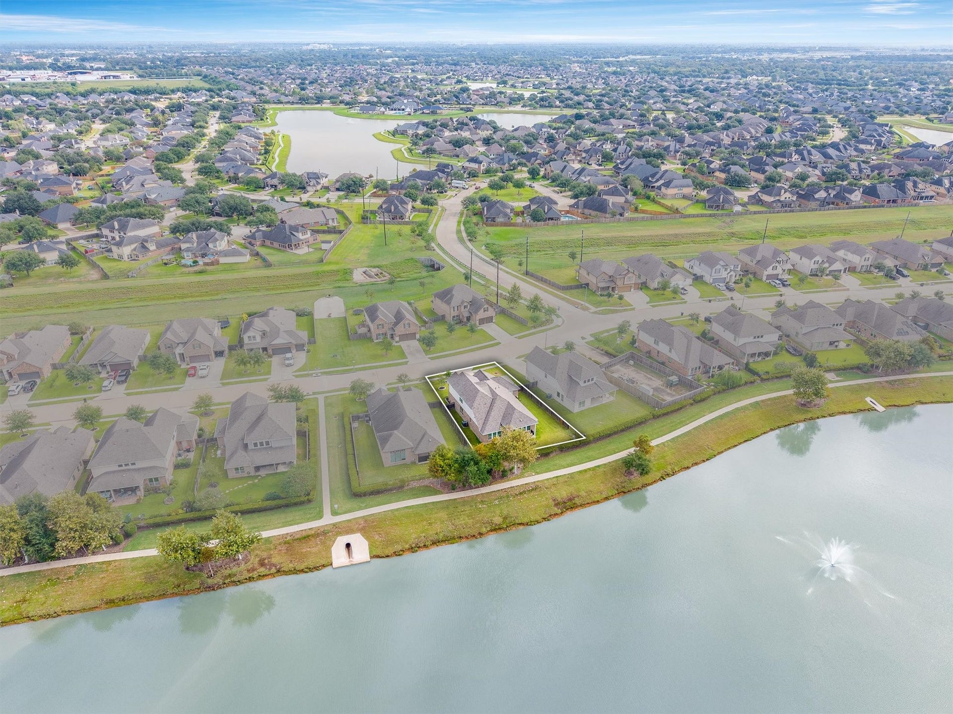 9034 Japonica Drive, Rosenberg, TX 77469 Water views, trail walks, and endless sunsets right outside your back gate.