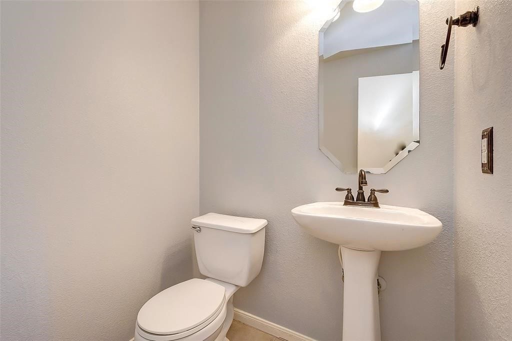 6707 Wild Pecan Trail, Houston, TX 77084 Half bathroom located on the first floor.