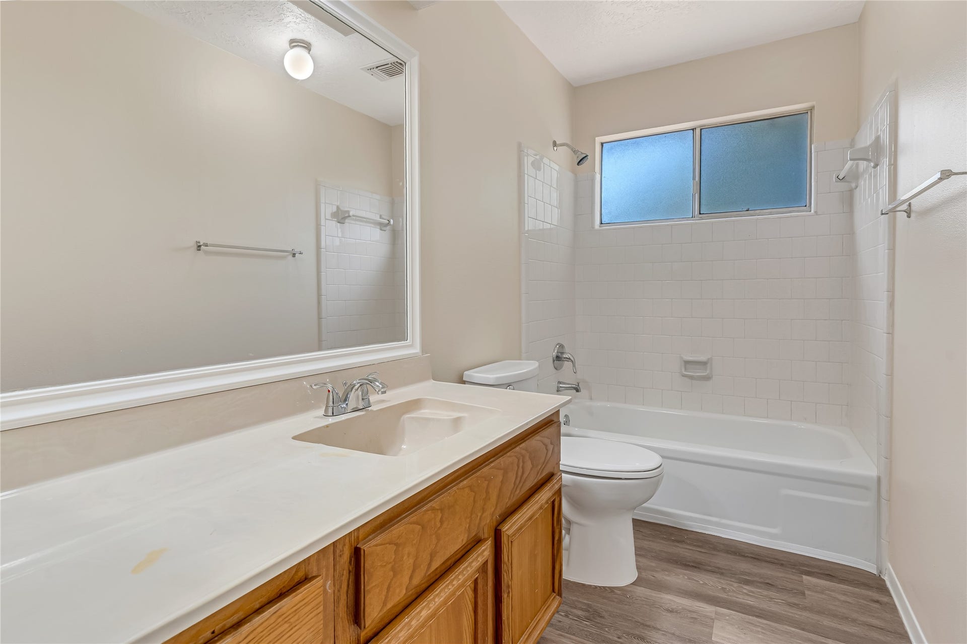 3727 Village Grove Drive, Humble, TX 77396 The guest bathroom offers a bright, clean, and inviting atmosphere, creating a refreshing space for family and guests alike. Its welcoming feel adds to the home's overall comfort and appeal.