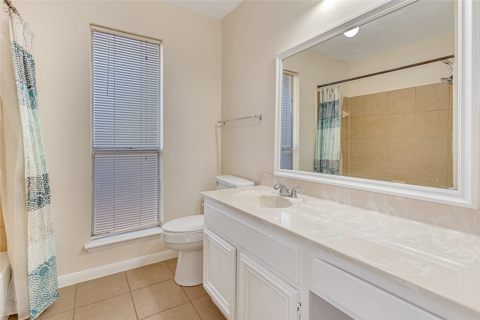 3727 Village Grove Drive, Humble, TX 77396 The bright and inviting primary bathroom offers a refreshing space to start your day and unwind in the evening. Its light-filled atmosphere creates a clean, airy feel, adding to the comfort and appeal of the primary suite.