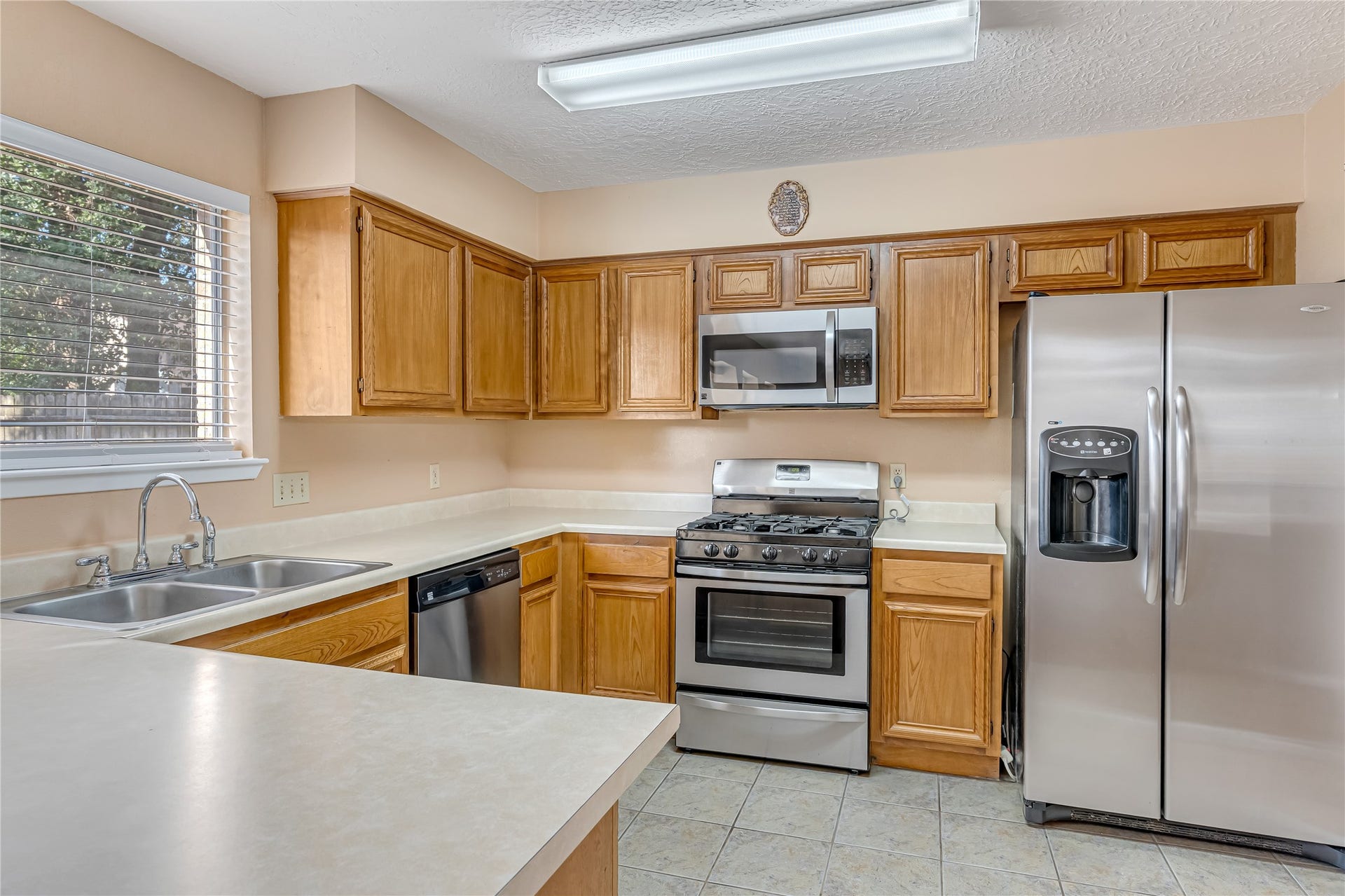 3727 Village Grove Drive, Humble, TX 77396 The chefs quarters feature recently updated stainless steel appliances, adding a fresh, modern touch to the kitchen. Perfect for preparing everyday meals or hosting family and friends, this inviting space combines style, functionality, and convenience.