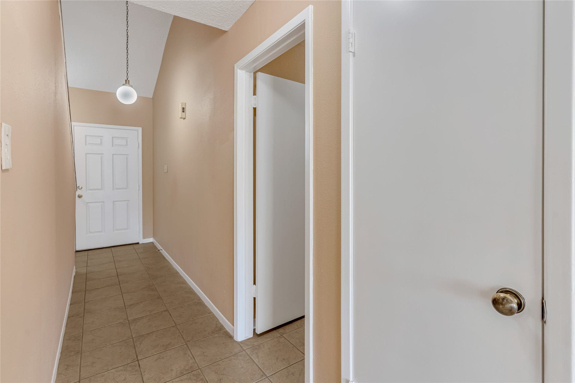 3727 Village Grove Drive, Humble, TX 77396 A wide, spacious hallway enhances the home's open feel, providing a comfortable flow between living spaces while creating a welcoming transition from one room to the next.