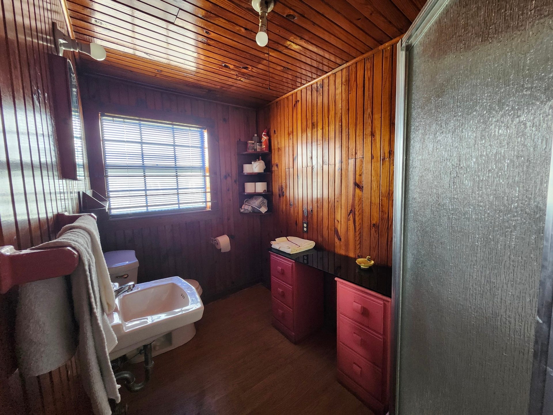 The bathroom is to the right facing the kitchen