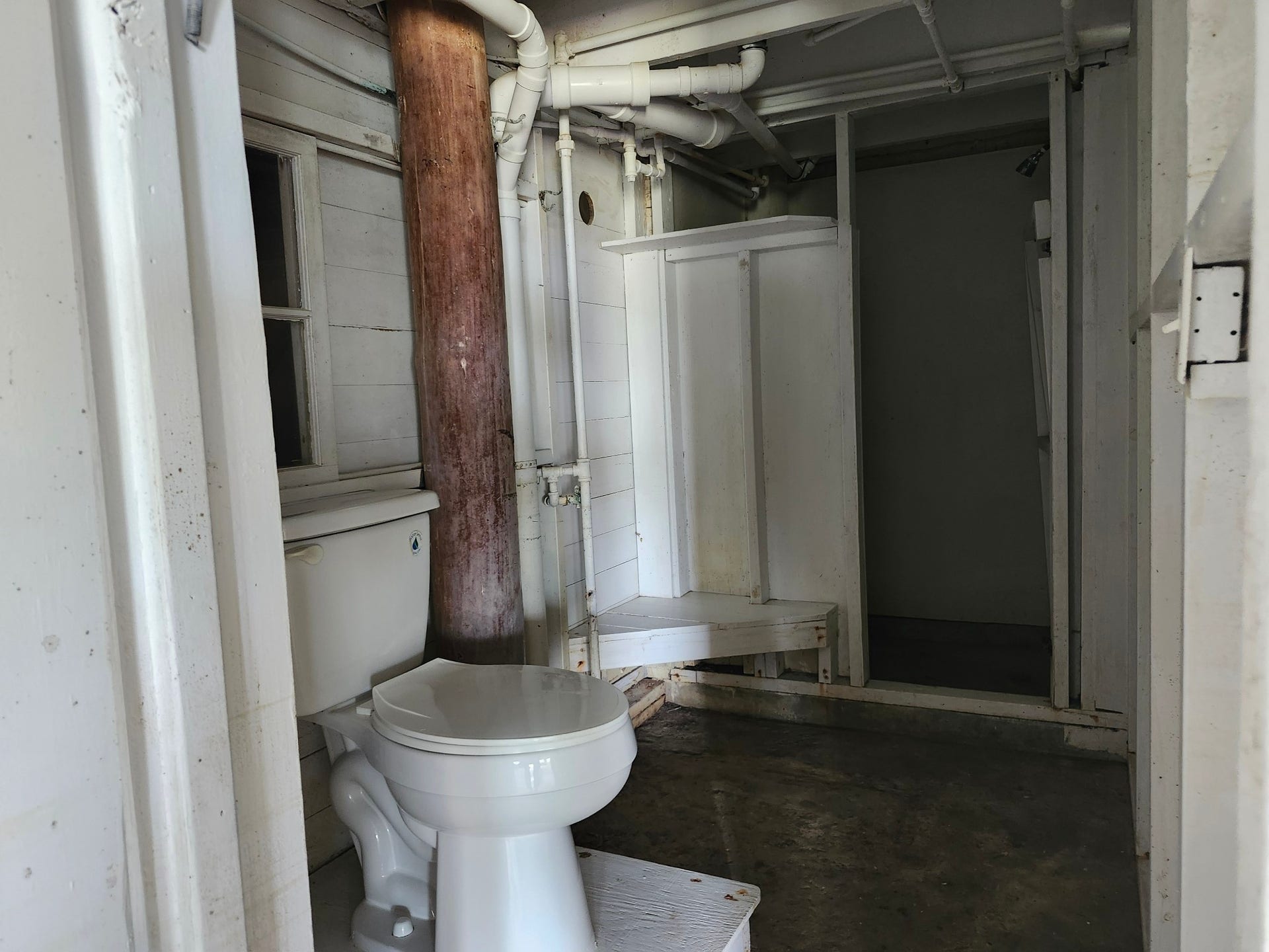 Shower and changing area with a toilet