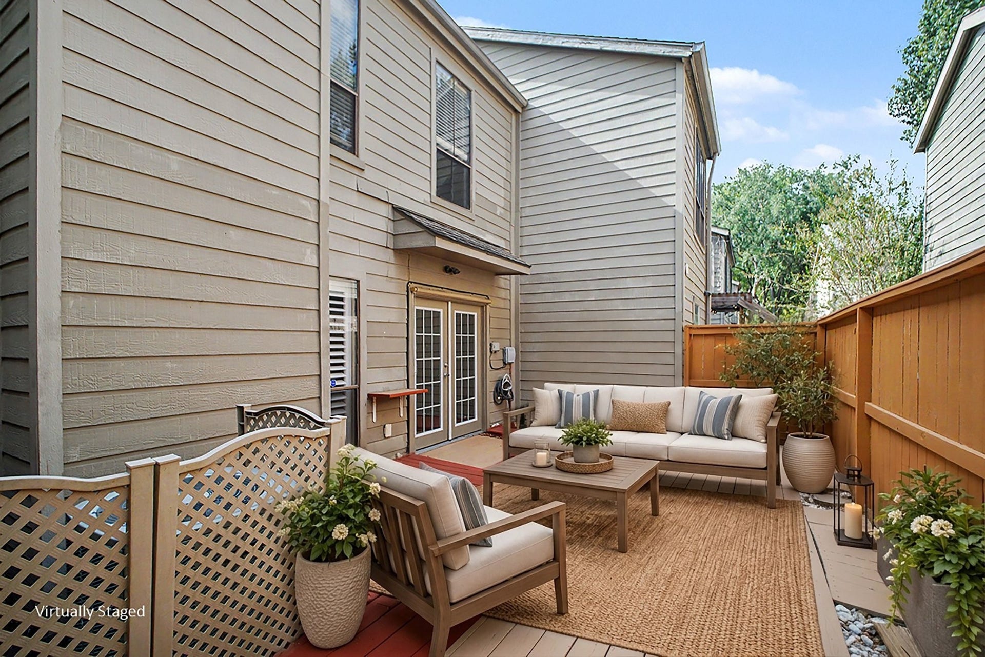 Virtually staged patio highlights a warm and inviting outdoor living space