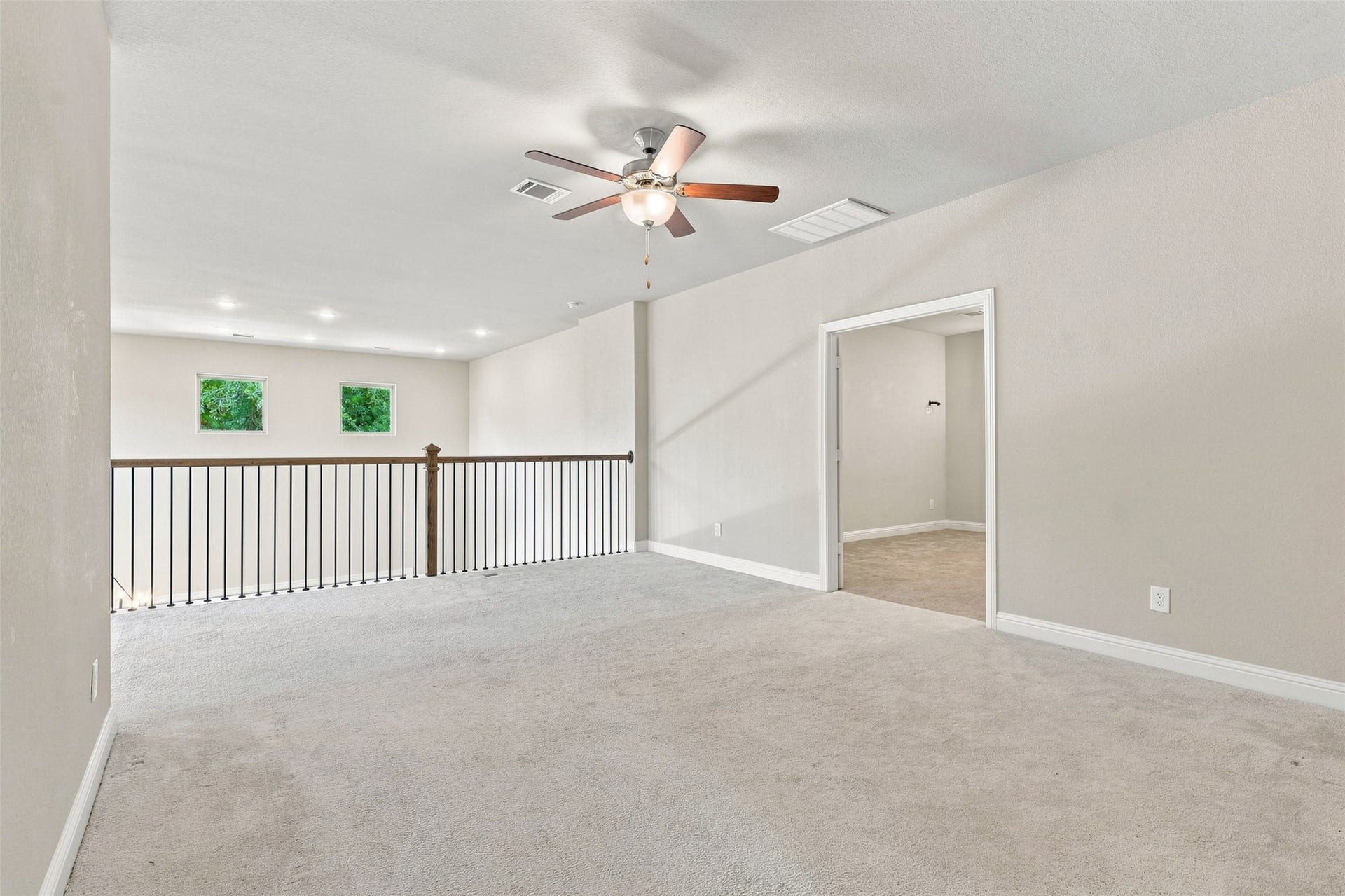 35 Gracenote Place, The Woodlands, TX 77375 Large game room creates an inviting space to relax, entertain, and make memories.