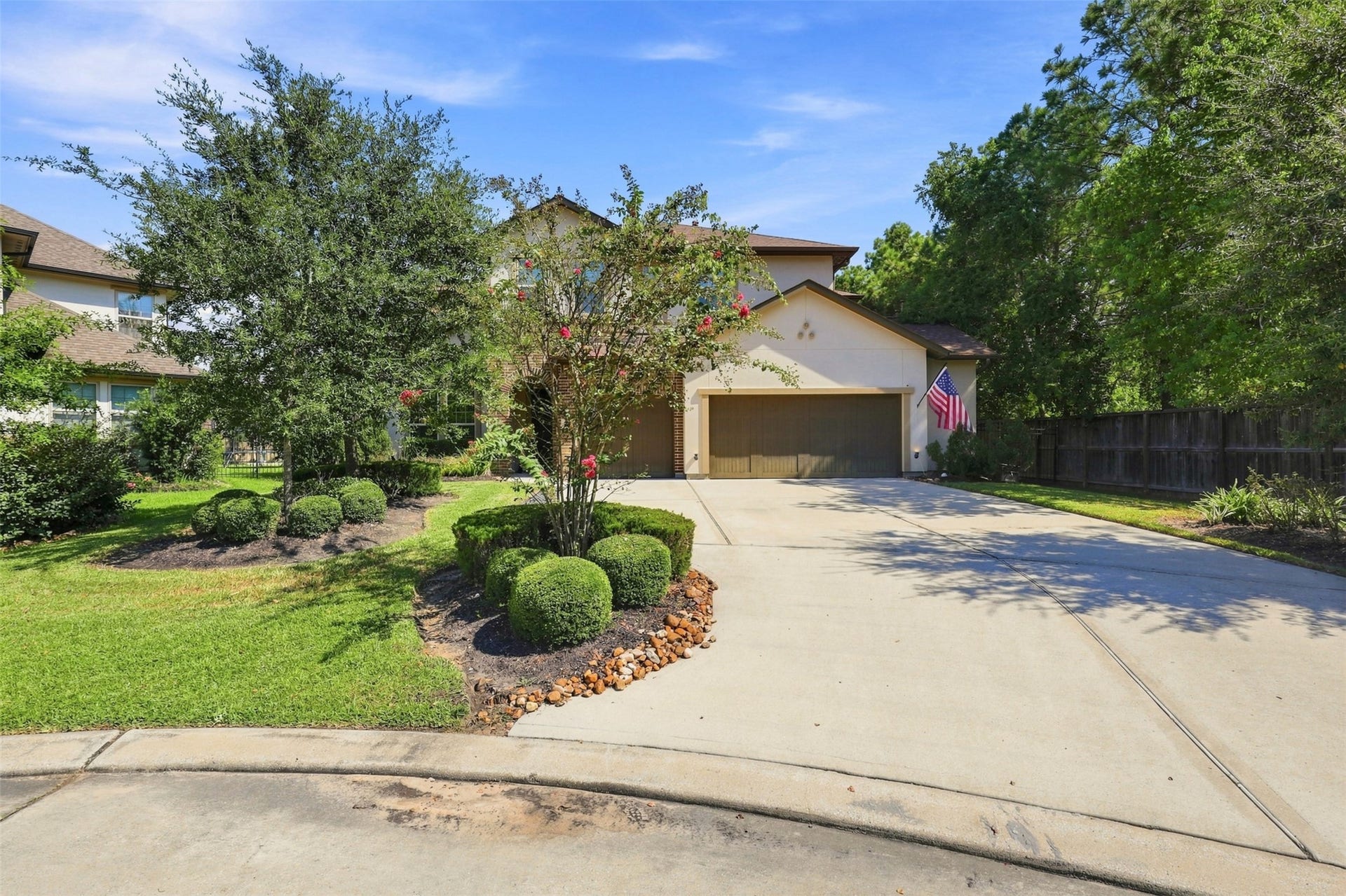 35 Gracenote Place, The Woodlands, TX 77375 Welcoming exterior with attractive curb appeal and a spacious three-car garage offering plenty of room for vehicles and storage.