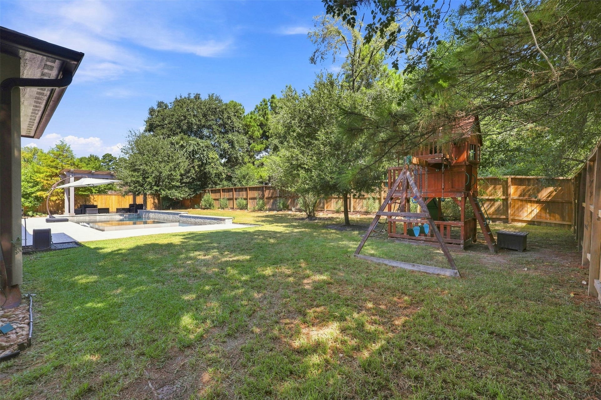 35 Gracenote Place, The Woodlands, TX 77375 An impressive outdoor oasis offers plenty of space to entertain, unwind, and enjoy everything this backyard has to offer.
