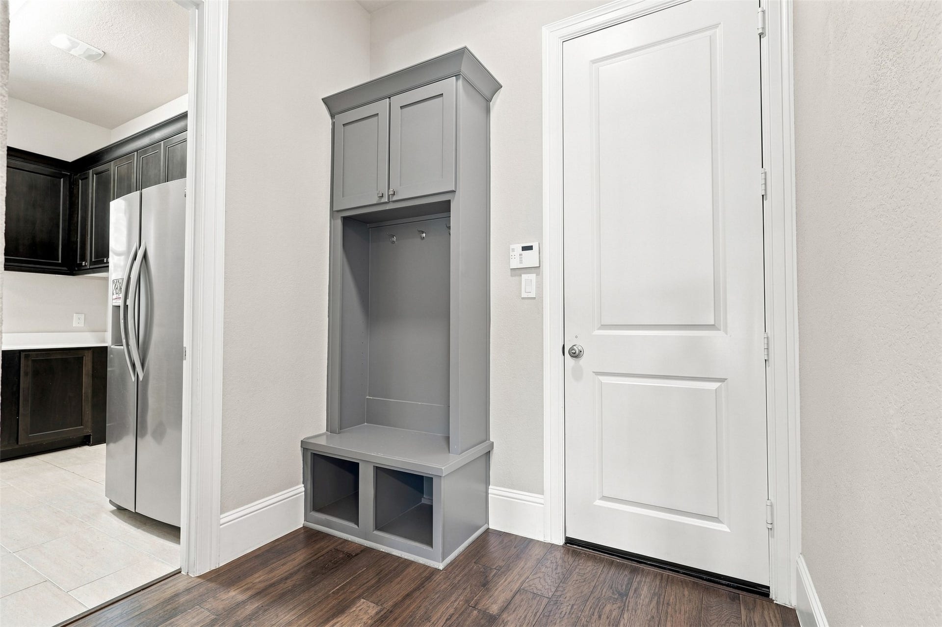 35 Gracenote Place, The Woodlands, TX 77375 A practical built-in storage area greets you at the garage entry, offering an organized drop zone and seamless access to the utility room.