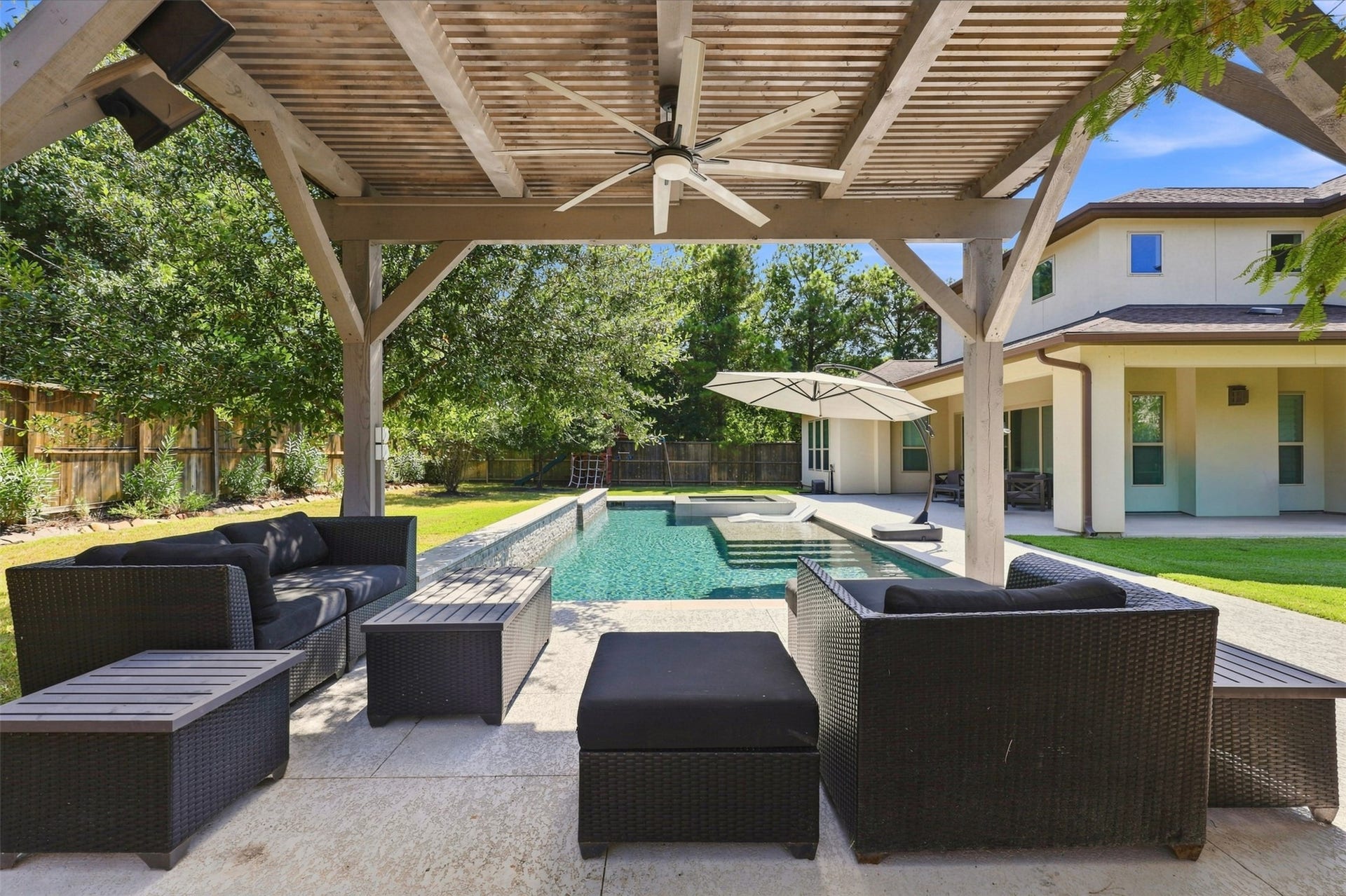 35 Gracenote Place, The Woodlands, TX 77375 The pergola provides additional outdoor seating and creates another inviting space for entertaining or relaxing.