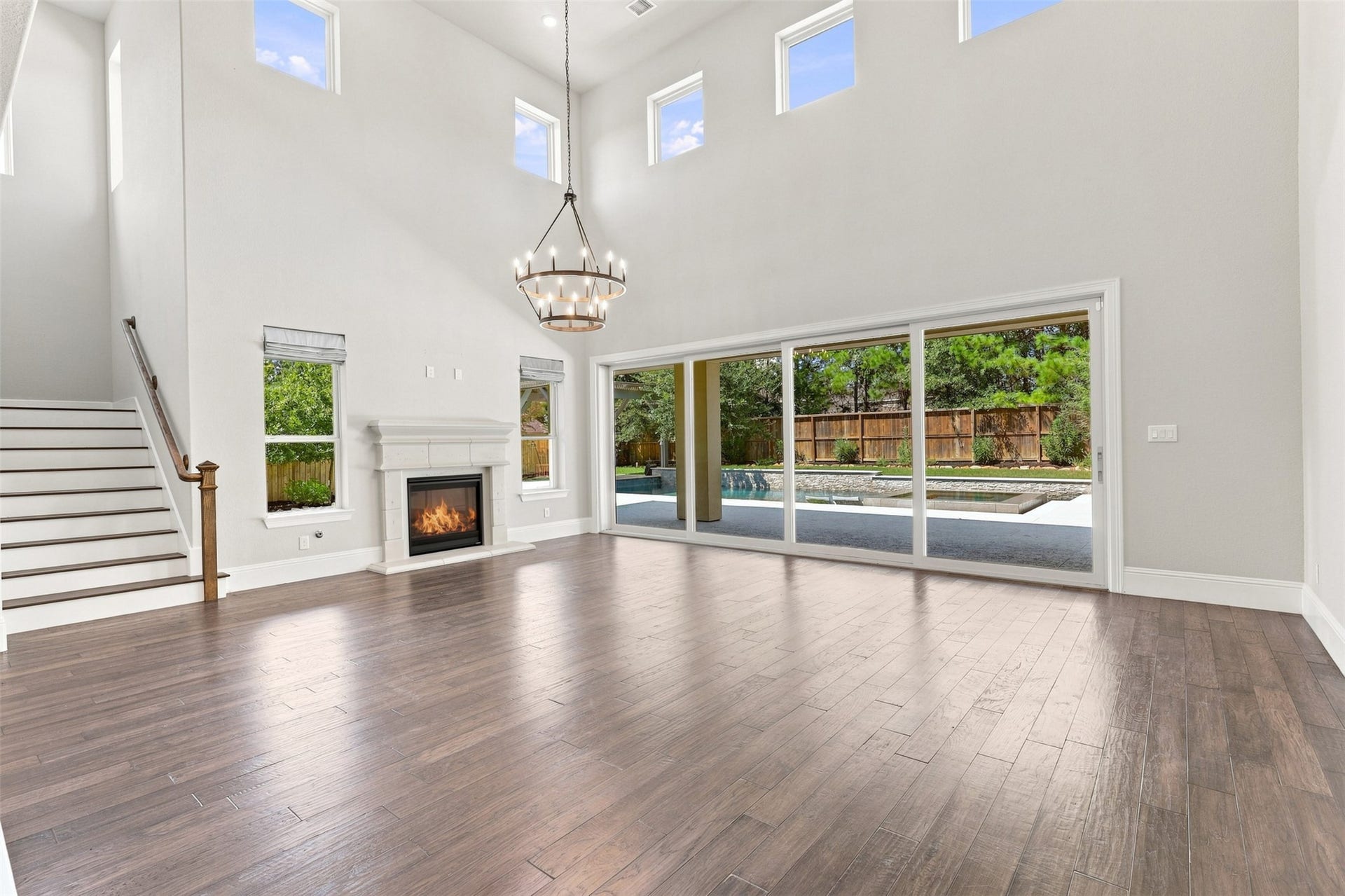 35 Gracenote Place, The Woodlands, TX 77375 Light-filled living room offers an open layout and expansive 20-foot sliding glass door overlooking the backyard oasis.