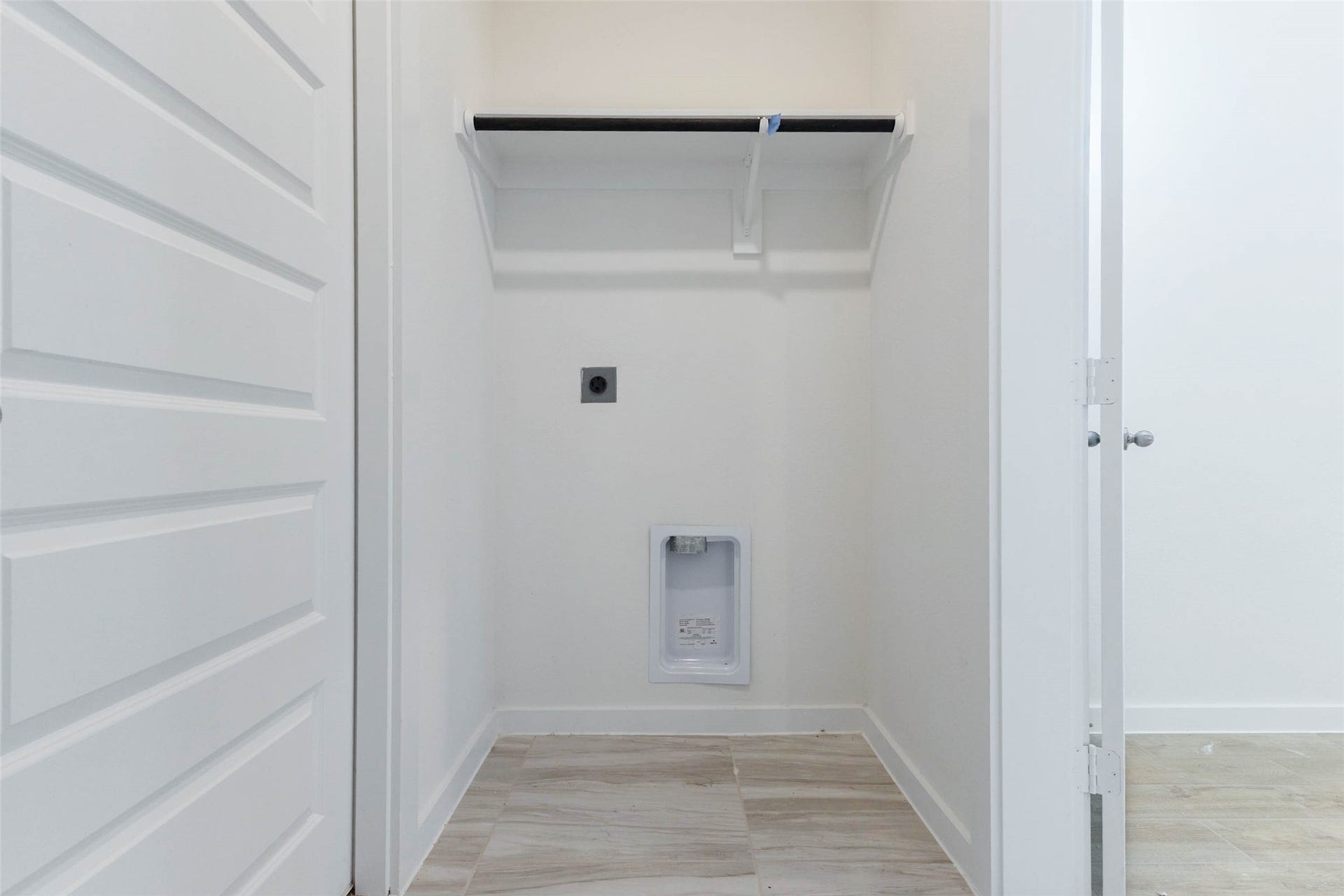 1115 Santee Court, Rosharon, TX 77583 The laundry room offers dedicated hookups, a built-in shelf above for detergent and supplies and a full-size door that keeps the noise out of the living space. Tile flooring cleans up easily, and the room is sized to fit a stacked or side-by-side washer and dryer. Having laundry close to the bedrooms saves steps and makes weekly chores simpler.