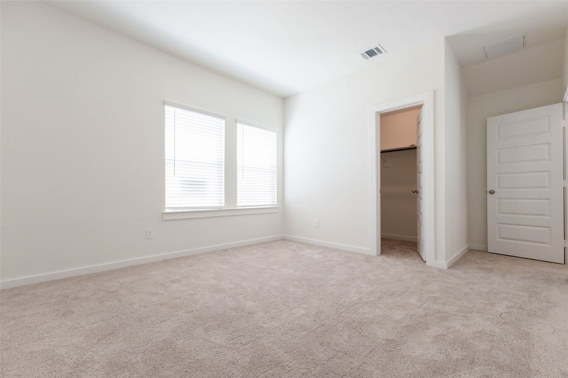 1115 Santee Court, Rosharon, TX 77583 This carpeted bedroom has two windows with blinds that fill the room with soft light, and a doorway to a closet. The neutral walls make it easy to decorate. It is a flexible space for a bedroom, guest room, nursery or home office with room for a desk and storage.