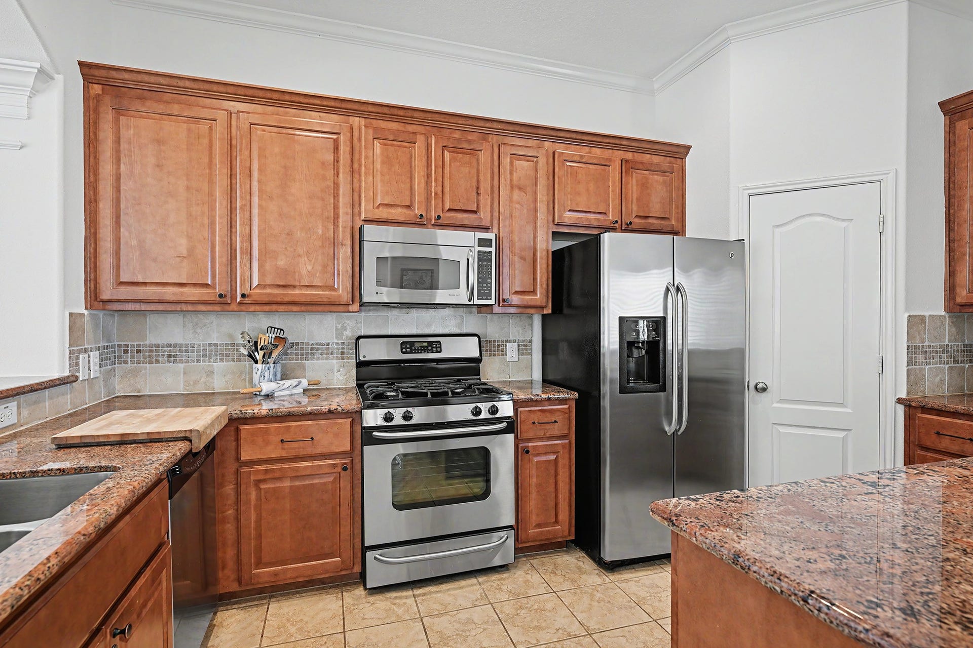 Open kitchen with ample storage and walk-in pantry