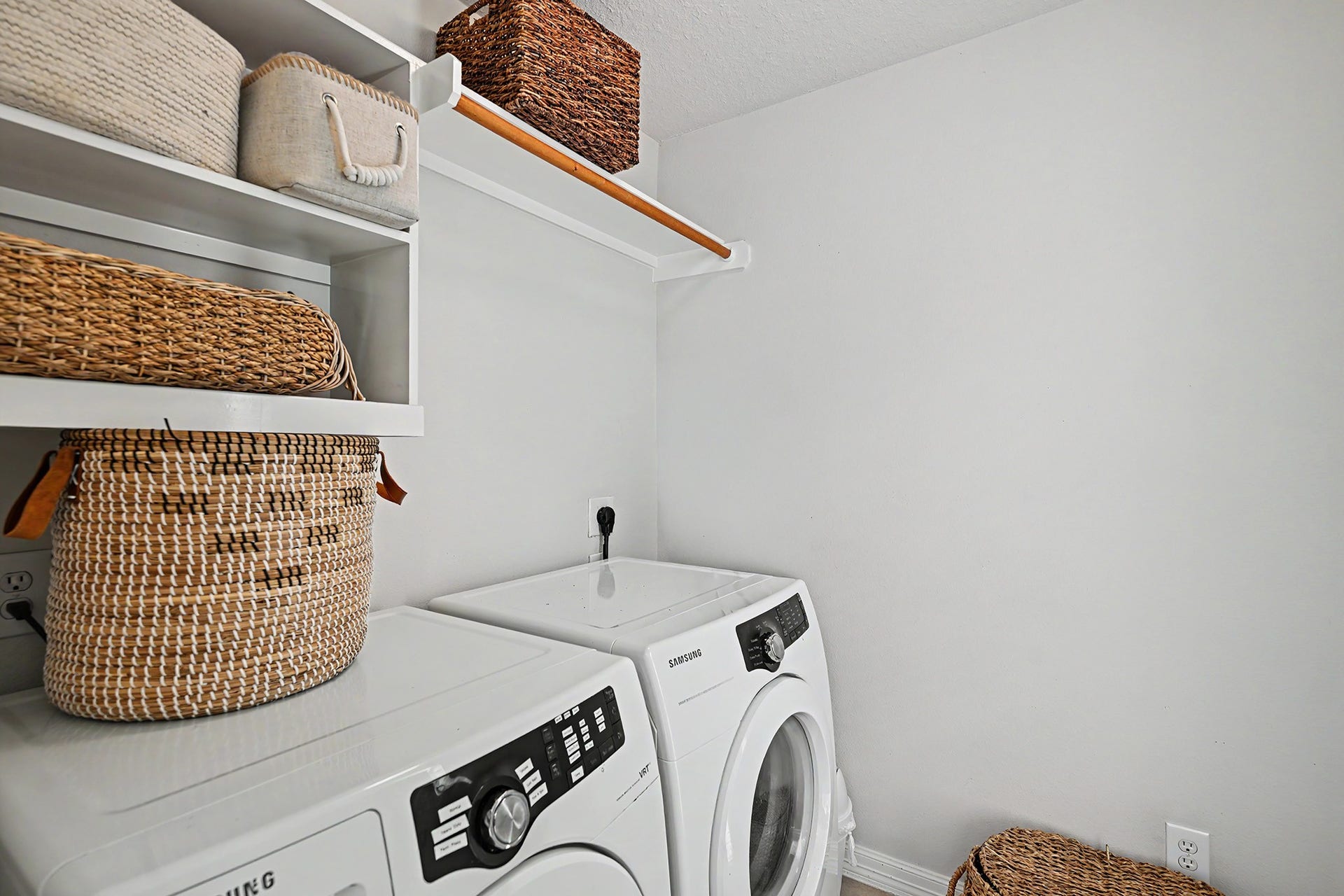 Utility room on the same floor as the primary bedroom