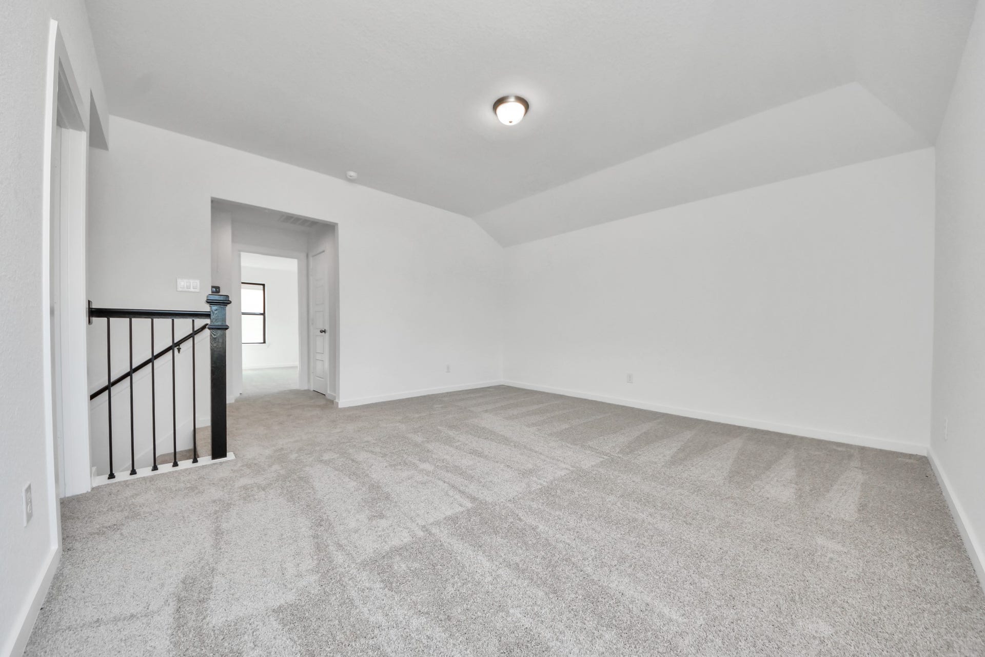 1017 Golden Glow Path, Magnolia, TX 77355 Come upstairs and enjoy a day of leisure in this fabulous game room! This is the perfect hangout spot or adult game room! Features plush carpet, high ceilings, custom paint and windows for plenty of natural light.