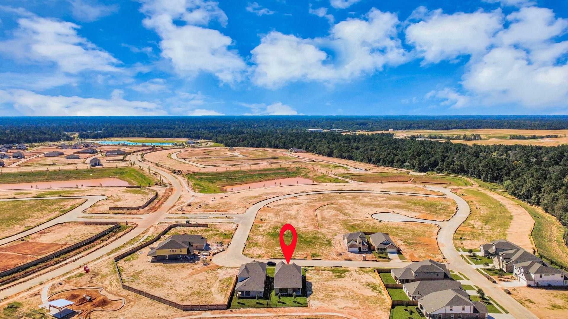 1017 Golden Glow Path, Magnolia, TX 77355 An aerial view of a spacious subdivision lot, highlighting a well-maintained yard and a fully fenced perimeter, offering both privacy and expansive outdoor space.
