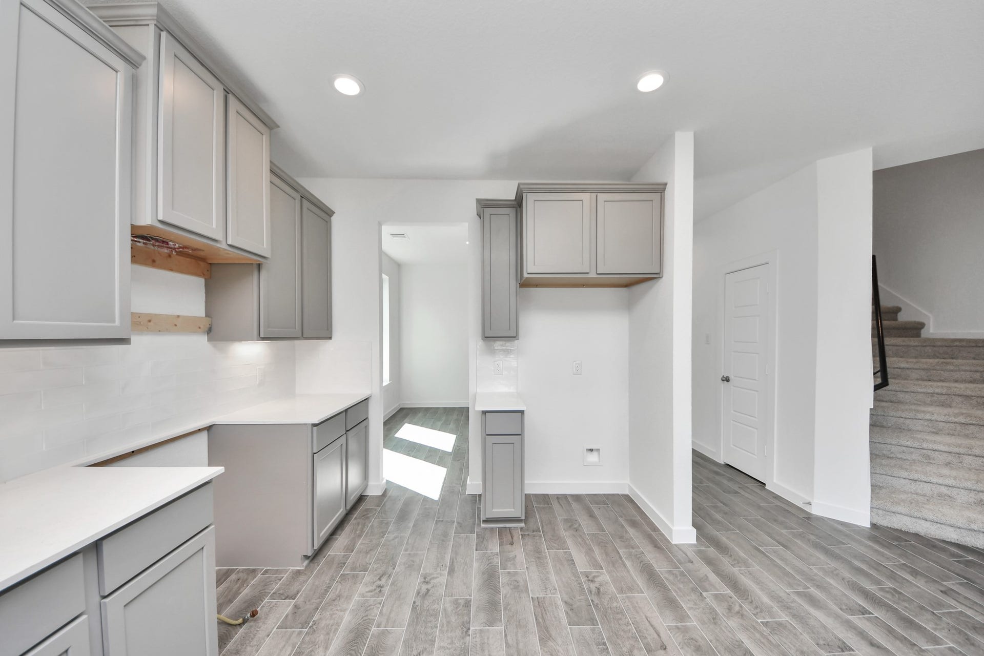 1017 Golden Glow Path, Magnolia, TX 77355 The extended counter area adds both practicality and style, making meal preparation a breeze. Every detail is thoughtfully designed to enhance the kitchen's functionality and aesthetic appeal.