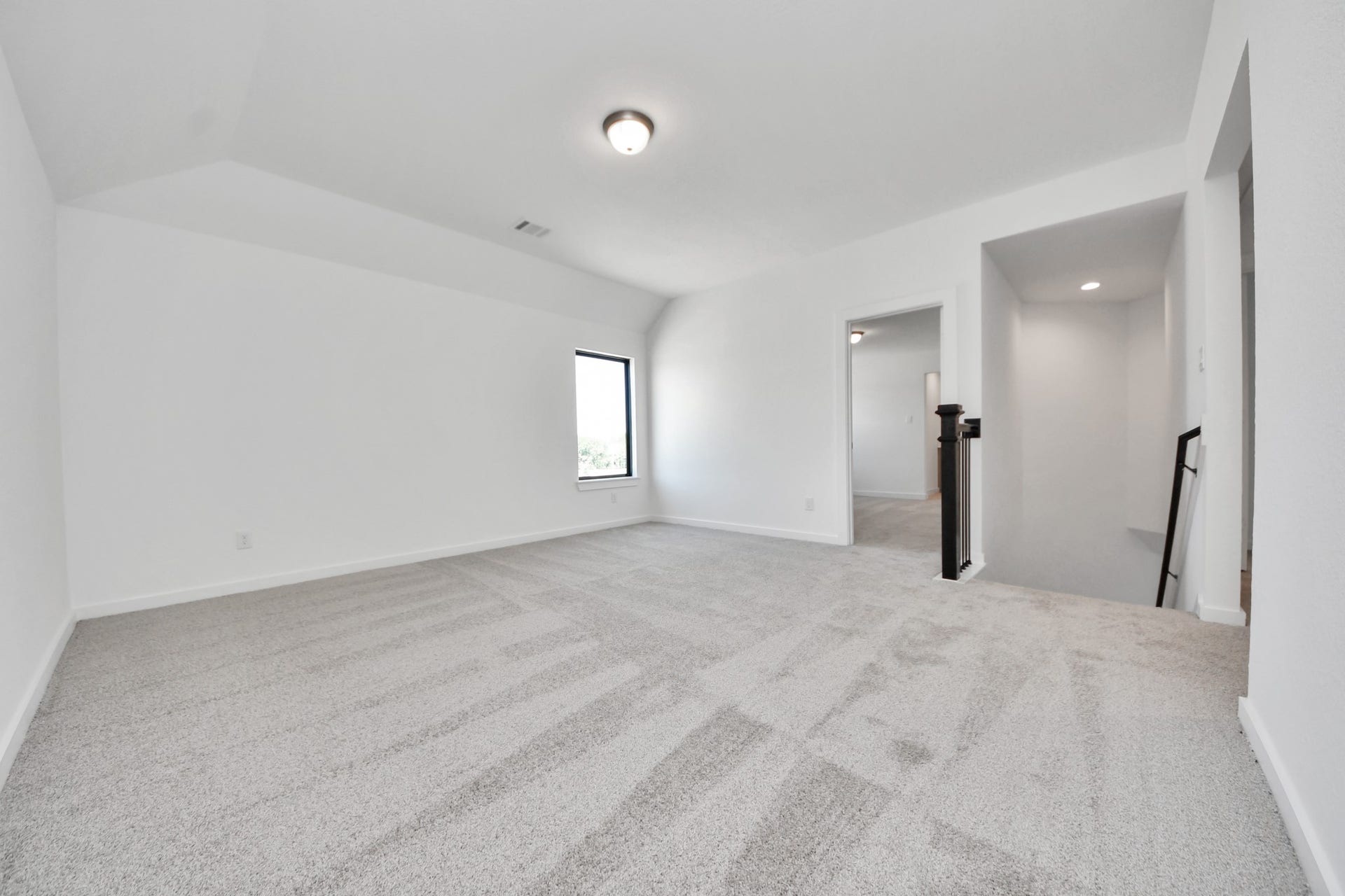 1017 Golden Glow Path, Magnolia, TX 77355 Come upstairs and enjoy a day of leisure in this fabulous game room! This is the perfect hangout spot or adult game room! Features plush carpet, high ceilings, custom paint and windows for plenty of natural light.