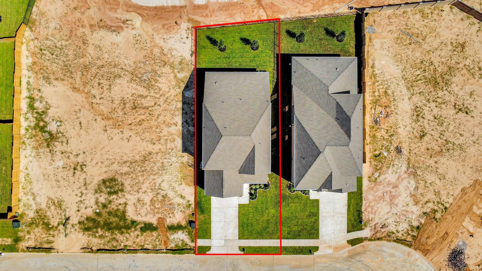 1017 Golden Glow Path, Magnolia, TX 77355 An aerial view of a spacious subdivision lot, highlighting a well-maintained yard and a fully fenced perimeter, offering both privacy and expansive outdoor space.