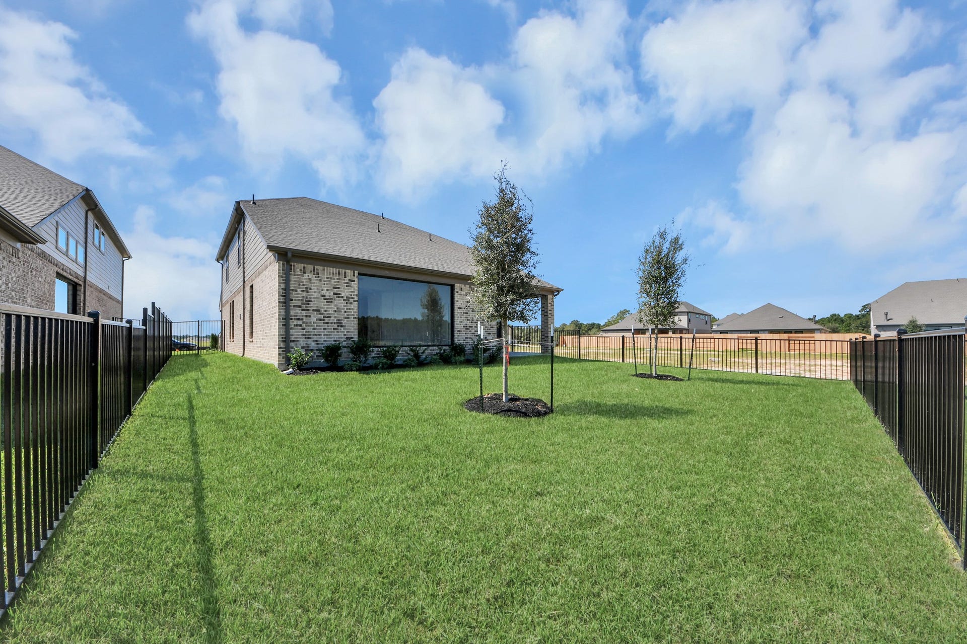 1017 Golden Glow Path, Magnolia, TX 77355 Experience outdoor living at its finest on this expansive covered patio, thoughtfully designed for BBQs and delightful outdoor dining.