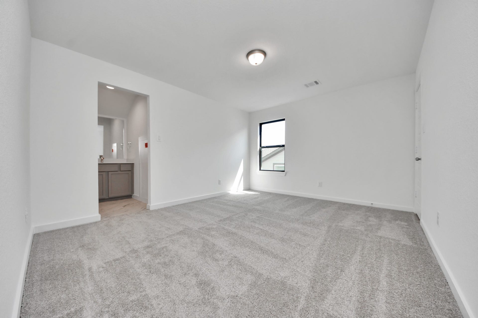 1017 Golden Glow Path, Magnolia, TX 77355 Generously sized secondary bedrooms featuring spacious closets, soft and inviting carpeting underfoot, large windows allowing plenty of natural light, and the added touch of privacy blinds for your personal retreat.