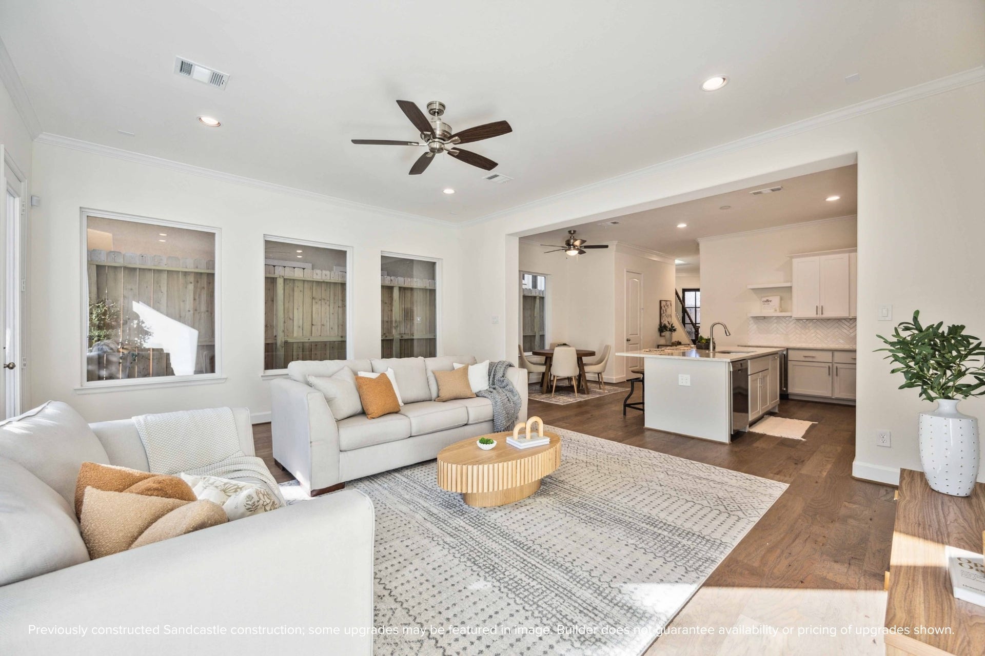 This wide-angle view shows off the magic of first-floor livingkitchen, dining, and living all connected in one beautifully cohesive space.
