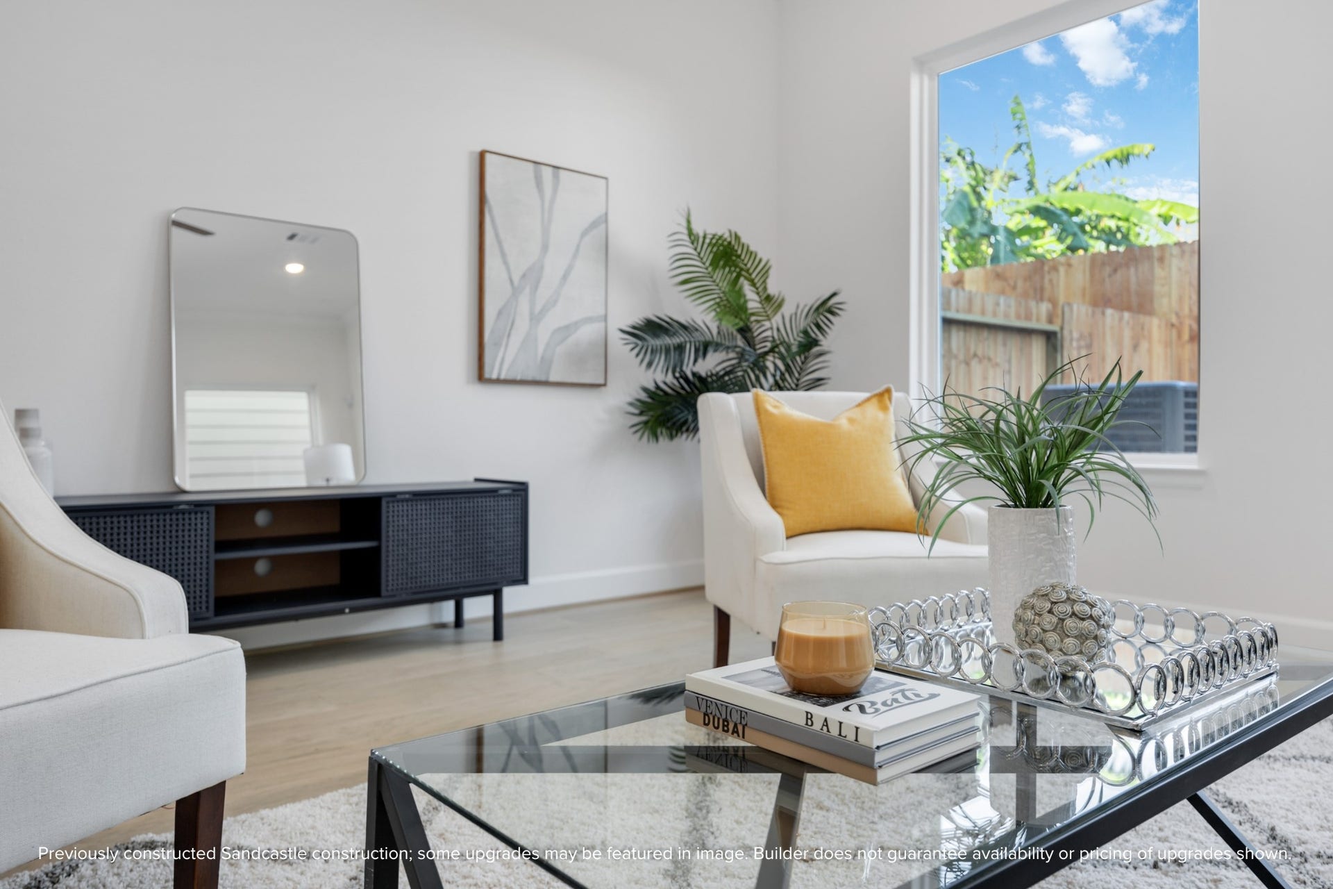 This cozy corner is all about the detailsdesigner trim, crown molding, and gorgeous wood-look flooring set the scene for stylish, everyday living.