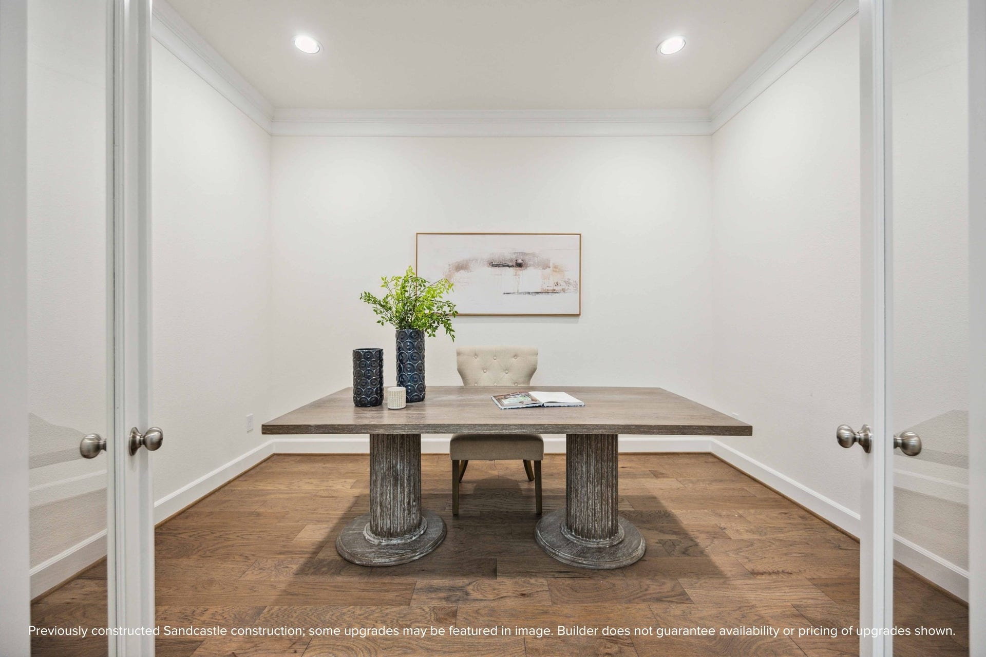 Need a quiet space to work or create? This glass-doored room near the entry is ideal for a study, Zoom room, or librarywith just enough privacy to stay focused.