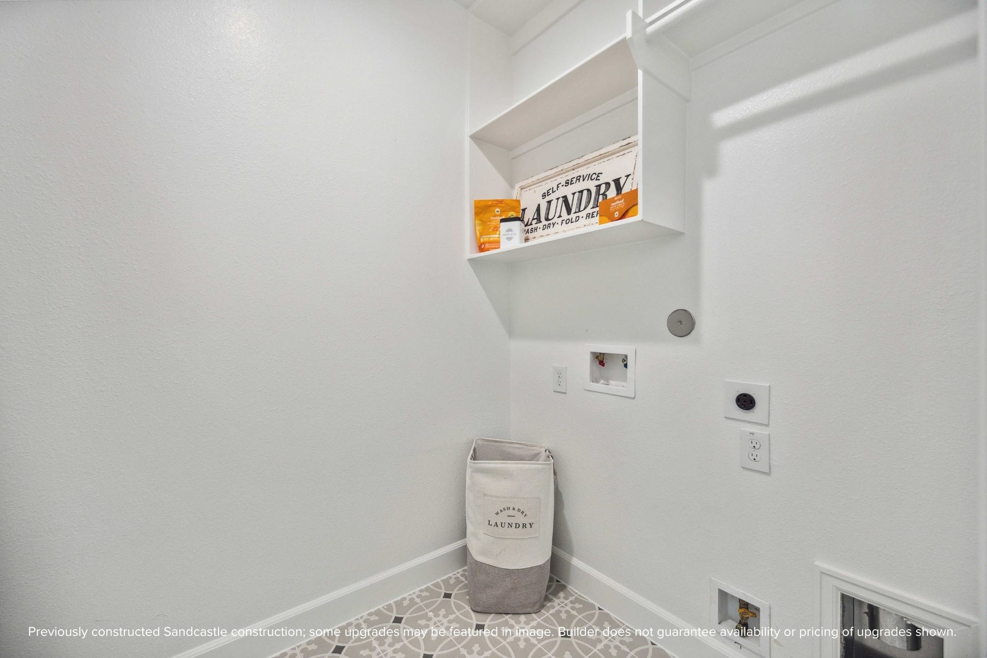 Clean design meets clever function in this dedicated laundry room. With built-in shelving and plenty of space to fold, it actually makes chores feeldoable.