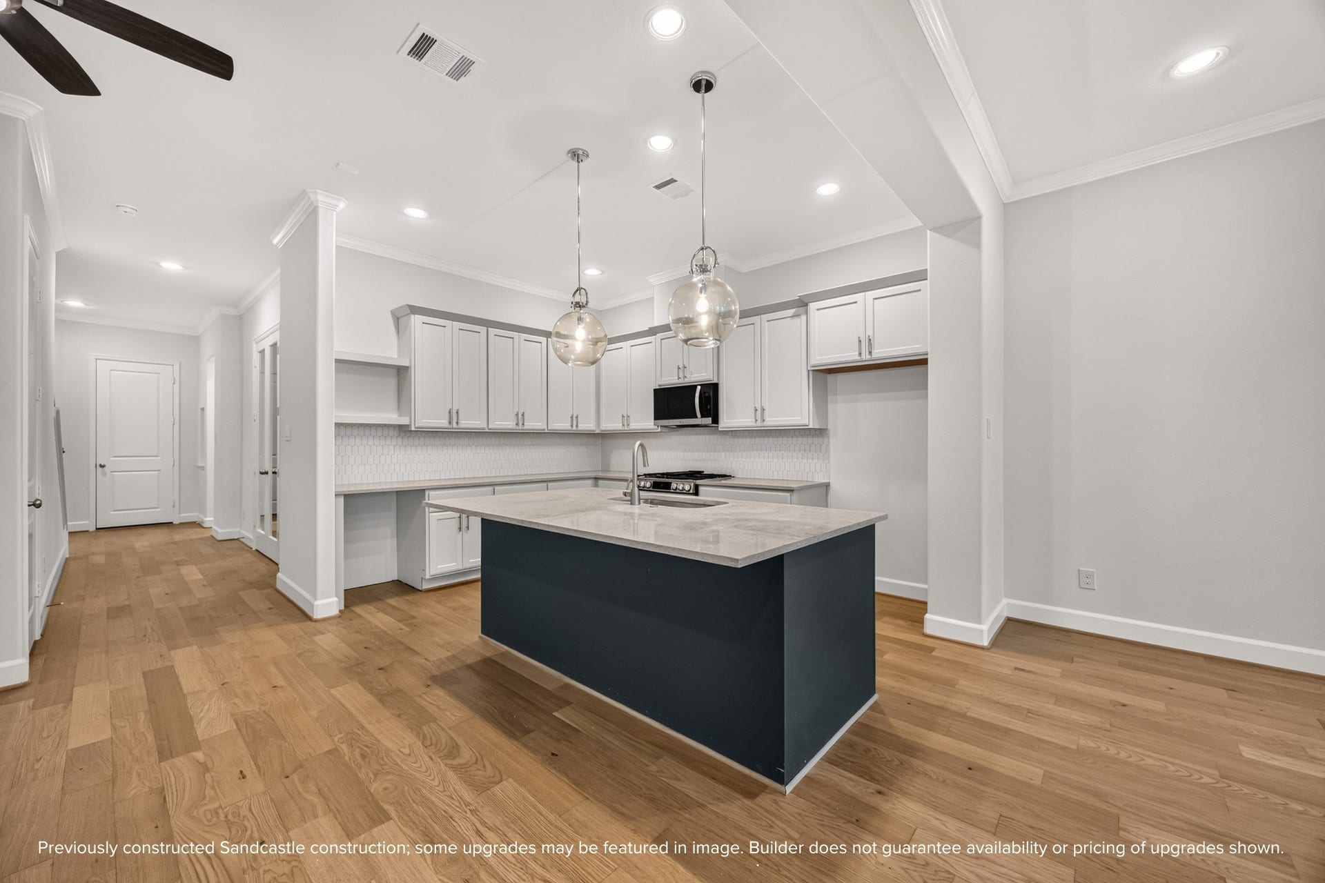 Zoom in on the beauty: crisp cabinetry, statement lighting, and luxurious quartz countertopseach detail curated to blend function and flair.
