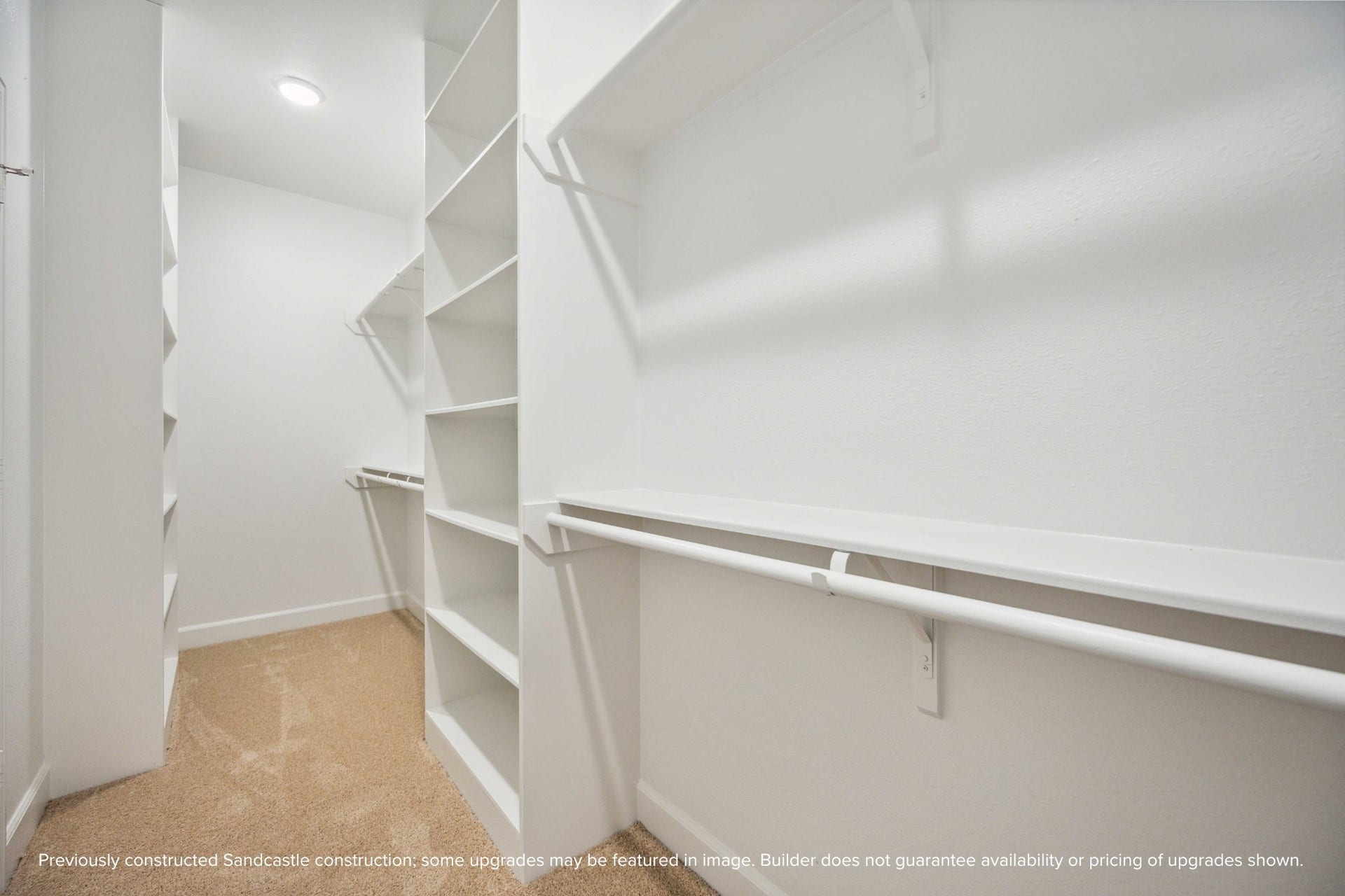 This is just one of two spacious walk-in closets in the primary suitedesigned to keep your wardrobe beautifully organized and always within easy reach.