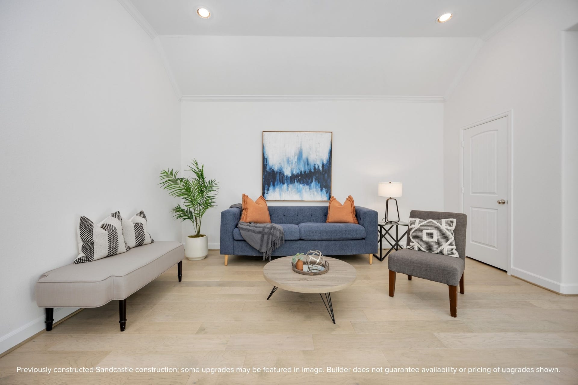 Crisp lines, curated color pops, and soft natural light make this upstairs living area feel like a boutique hotel loungeright in your own home.