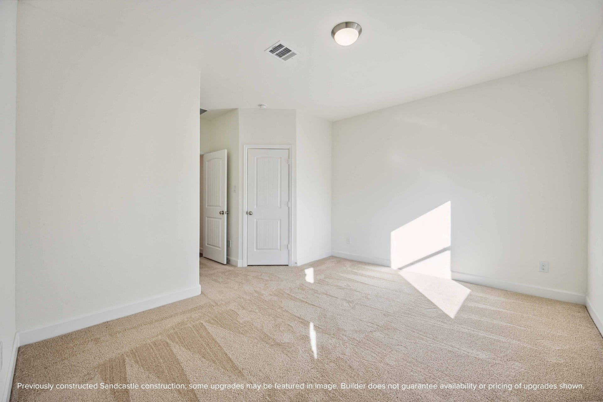 Let the sunlight pour in. This secondary bedroom feels anything but secondary with its spacious layout and warm energy.