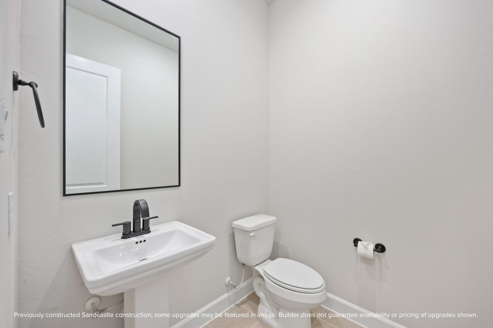 This powder bath may be petite, but its polished to perfection. With sleek fixtures and a splash of charm, its the kind of space guests will remember.