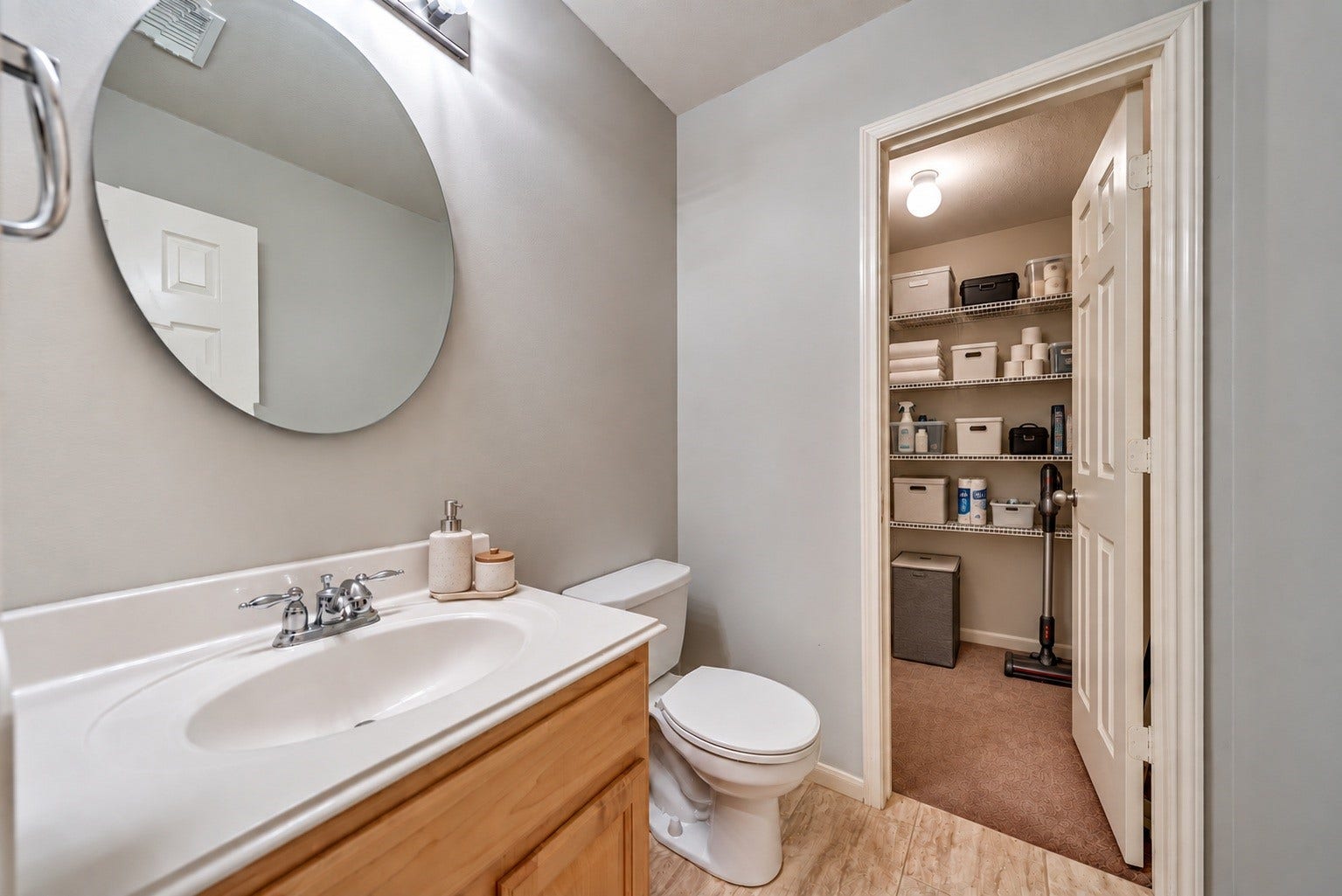 1859 Pembrook Circle, Conroe, TX 77301 Virtually Staged half bath and attached storage closet.