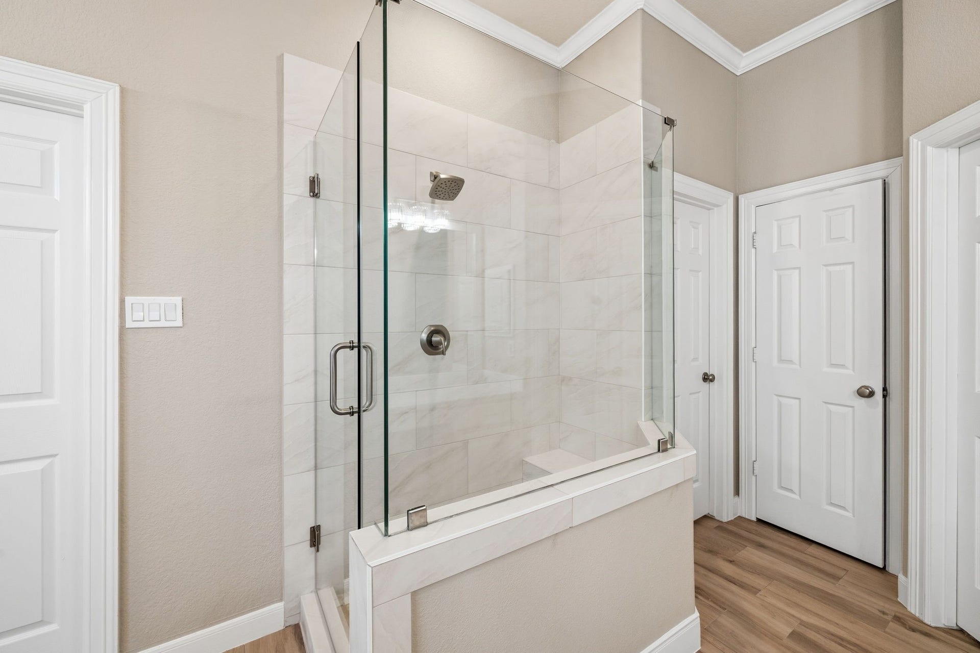 7514 Water Wood Trail, Kingwood, TX 77346 Elegant updated primary bathroom featuring a modern glass-enclosed shower