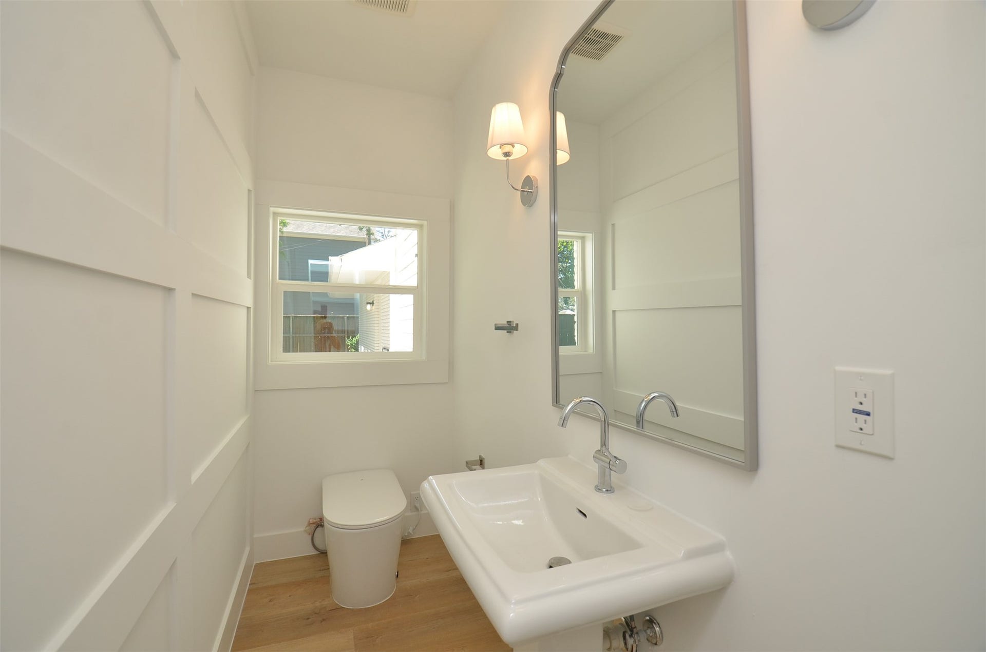 1207 Martin Street, Houston, TX 77018 Half bath with Smart toilet conveniently located downstairs for family and guests.