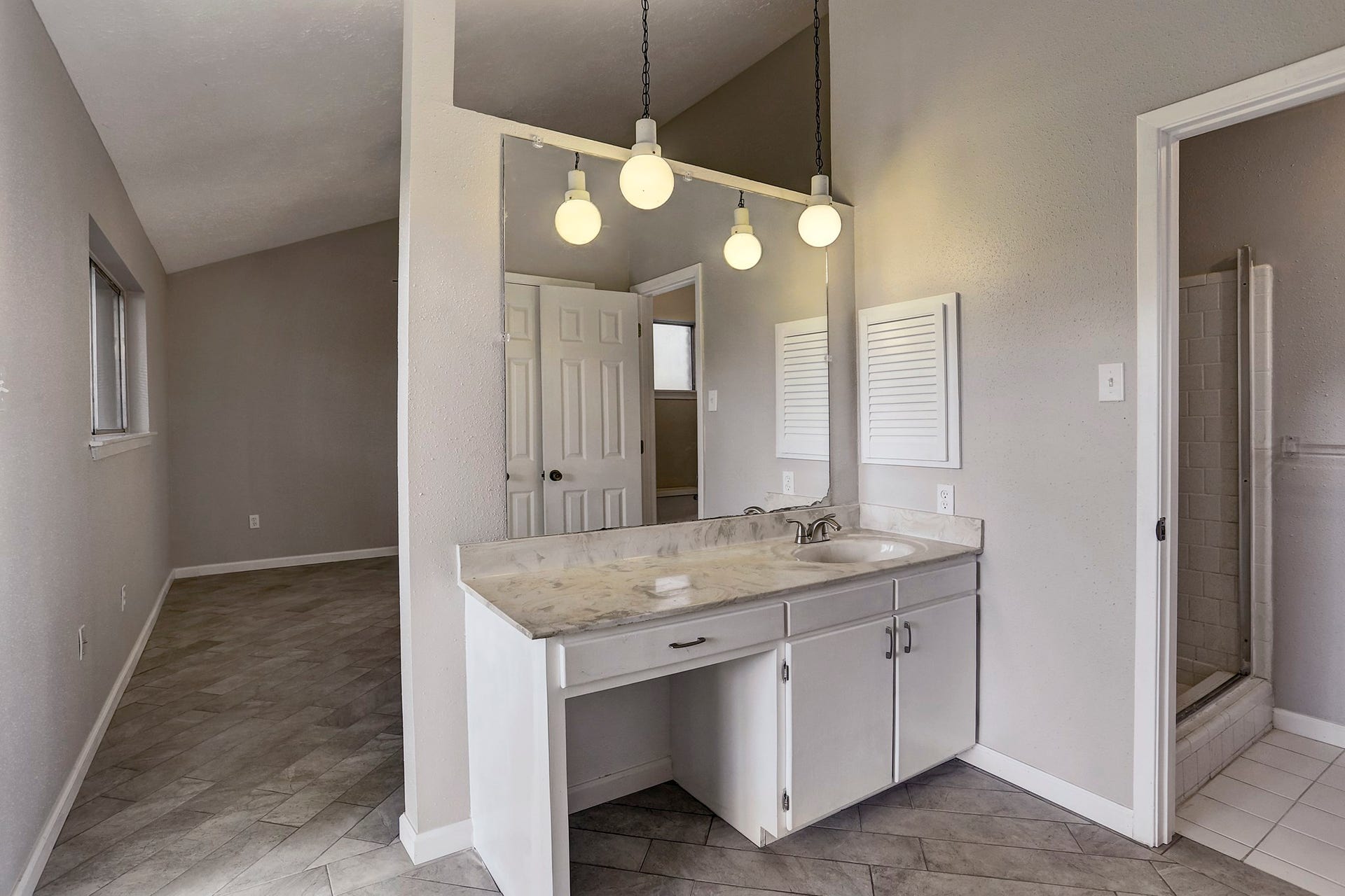 Impeccable Master bath with separate vanity in cultures Marble counters