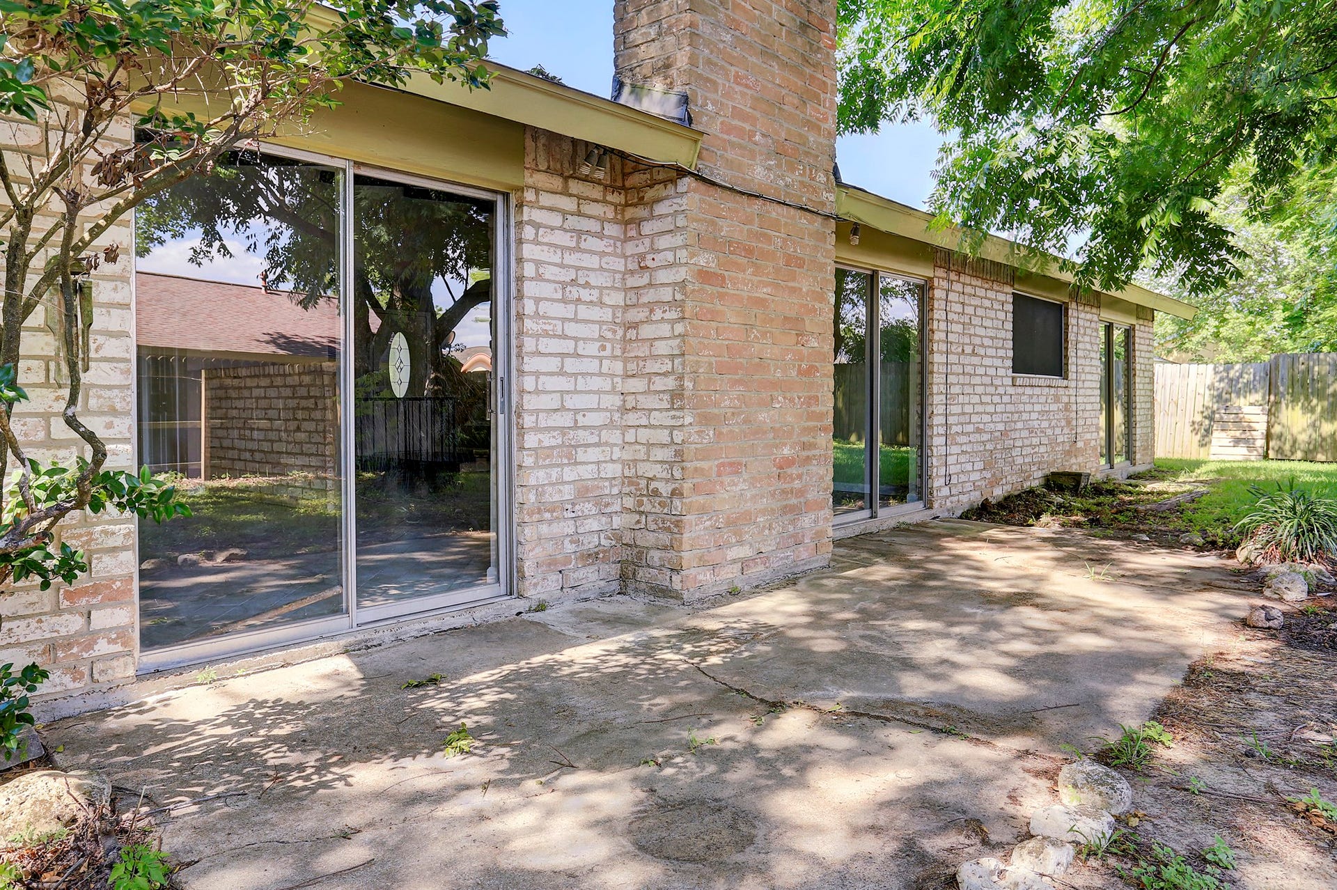 Beautiful back deck from wall-of-glass windows, ideal for entertaining