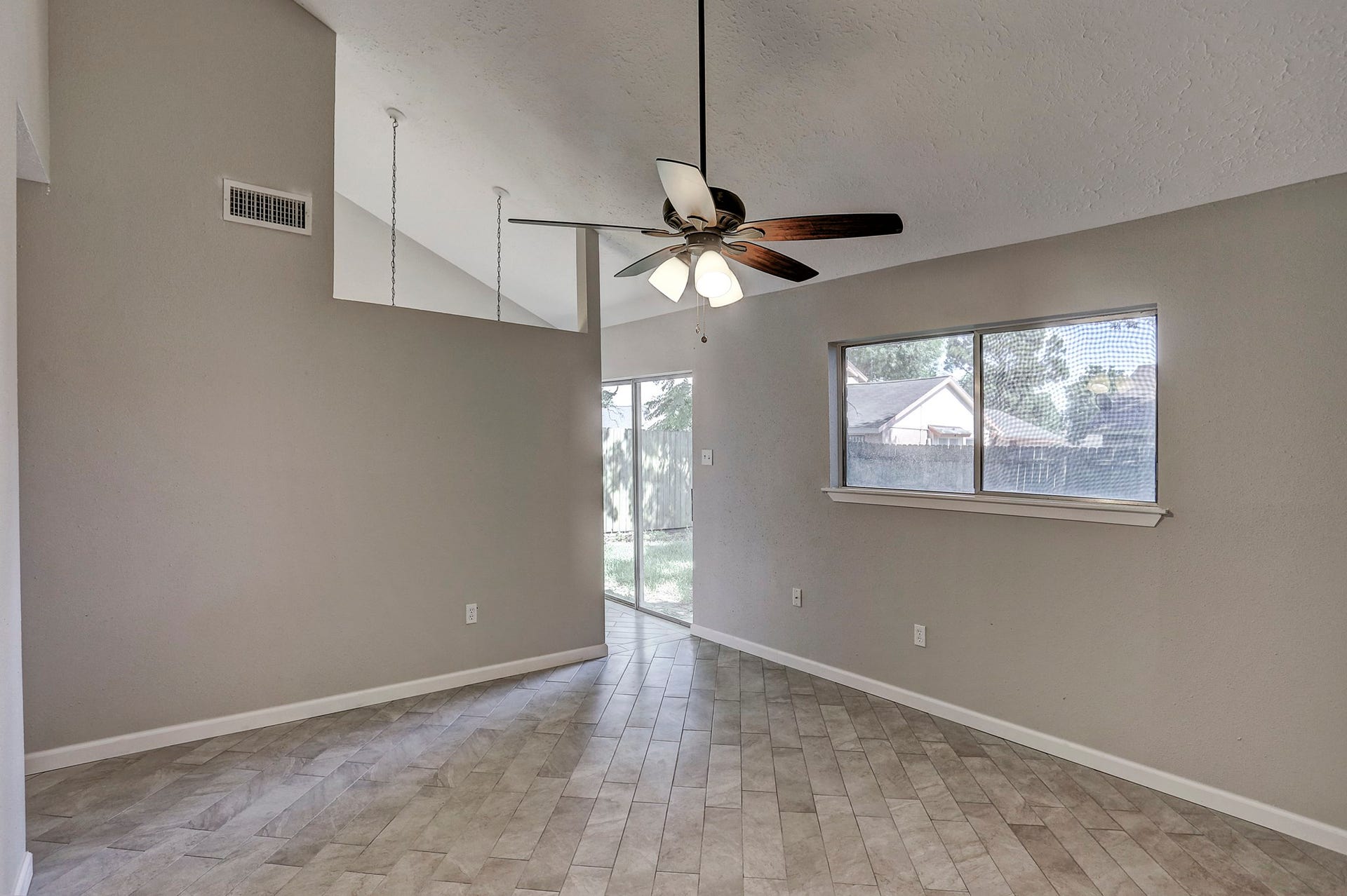 Brand new HVAC system, upgraded tile flooring & large windows throughout