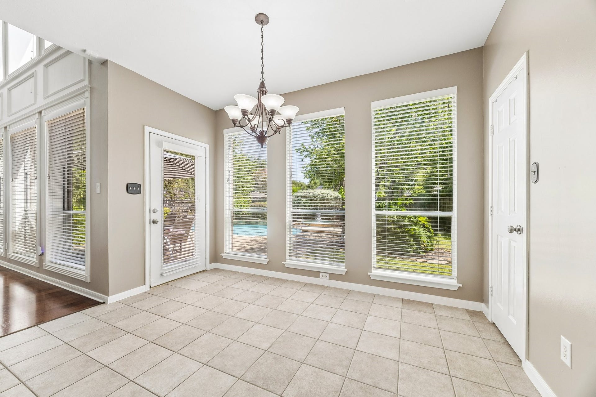 9618 Randon Lane, Missouri City, TX 77459 The Breakfast/Casual Dining Area. Imagine sipping coffee here enjoying your morning view to the pool and spa.