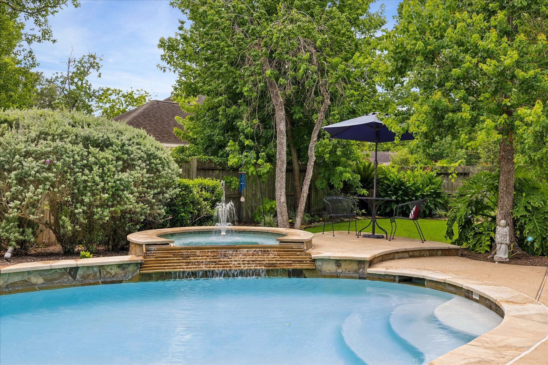 9618 Randon Lane, Missouri City, TX 77459 This home offers Pool & Spa and lush landscaping.