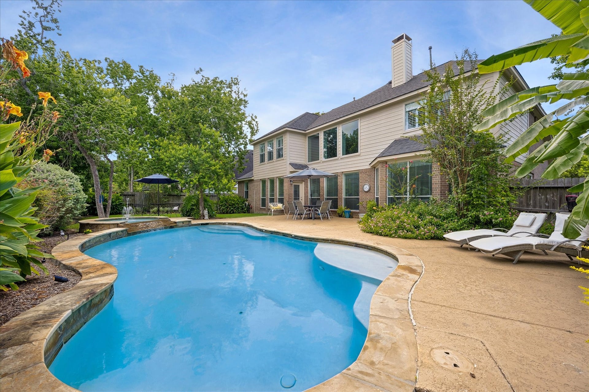 9618 Randon Lane, Missouri City, TX 77459 Enjoy cooling down in your own private swimming pool.