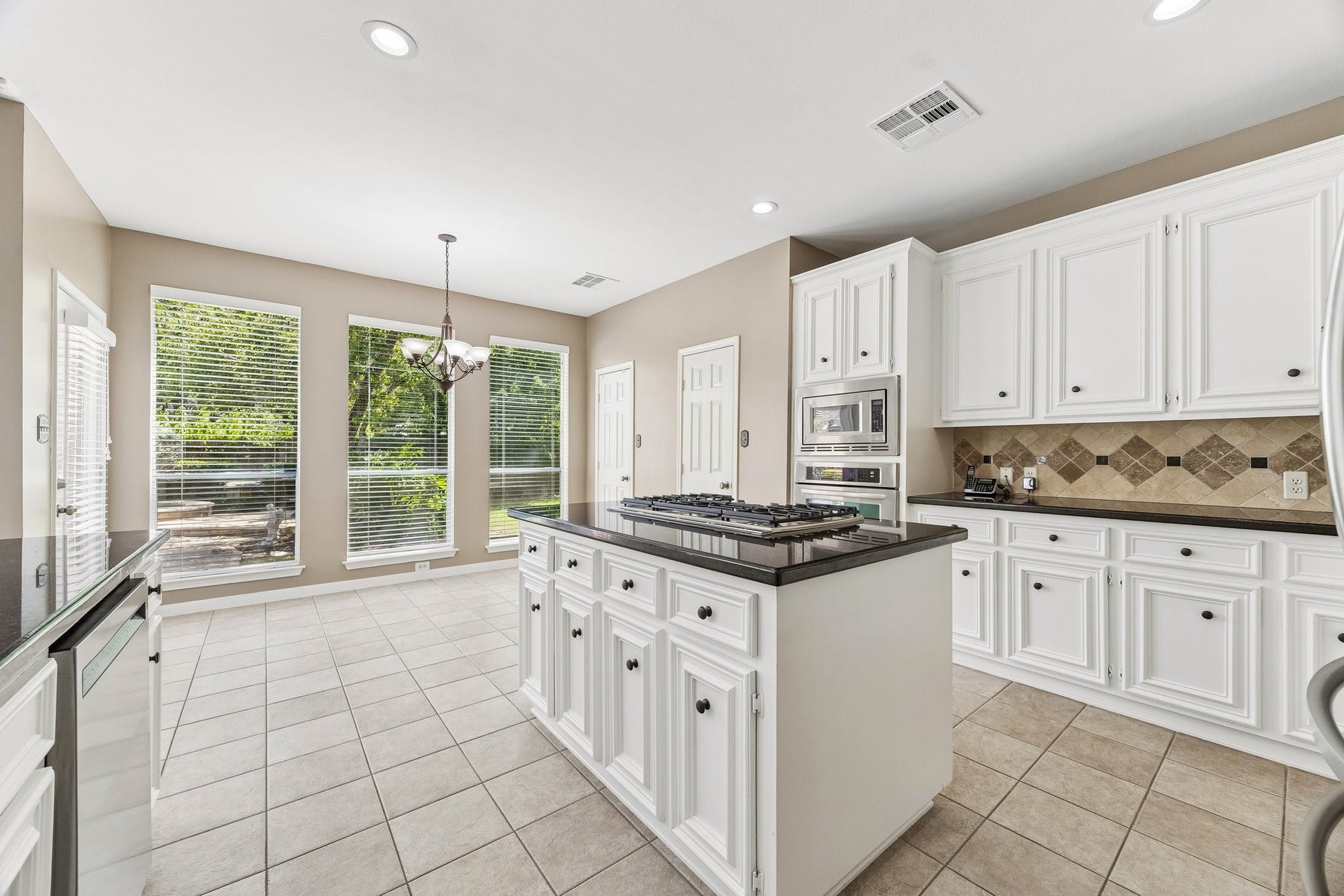 9618 Randon Lane, Missouri City, TX 77459 Cabinets galore and a nice size pantry.
